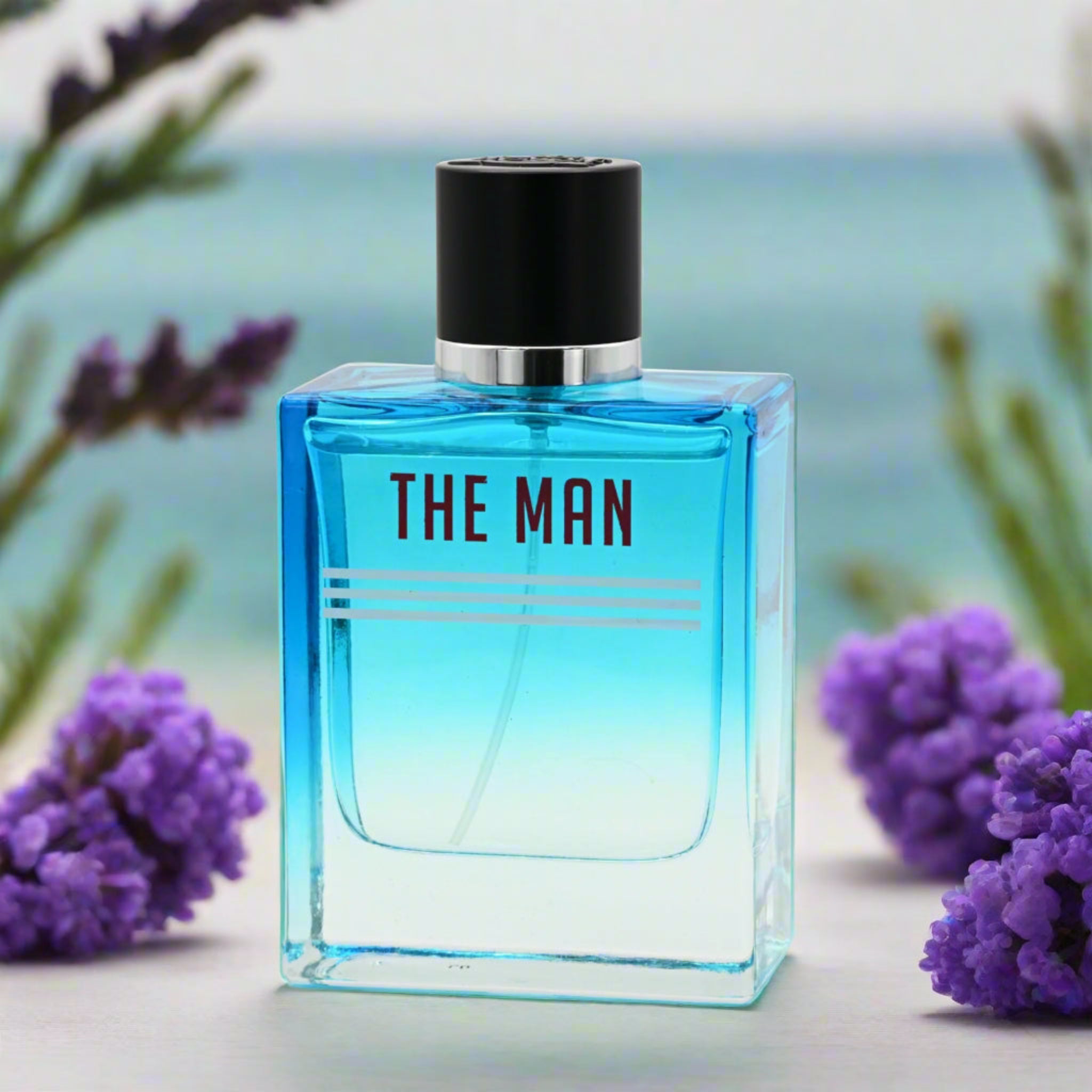 Blue perfume bottle labeled 'THE MAN' with lavender flowers in the background