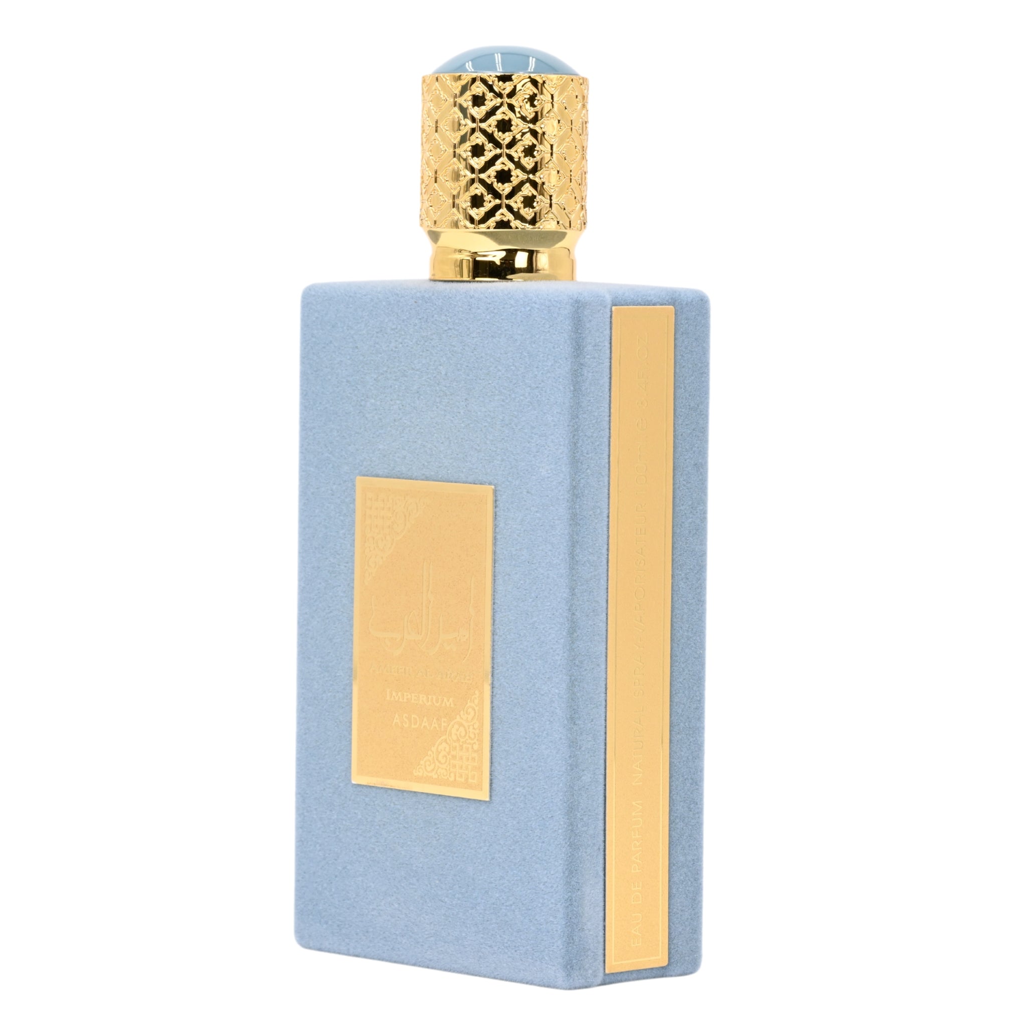 Perfume bottle with gold cap and decorative elements on a white background