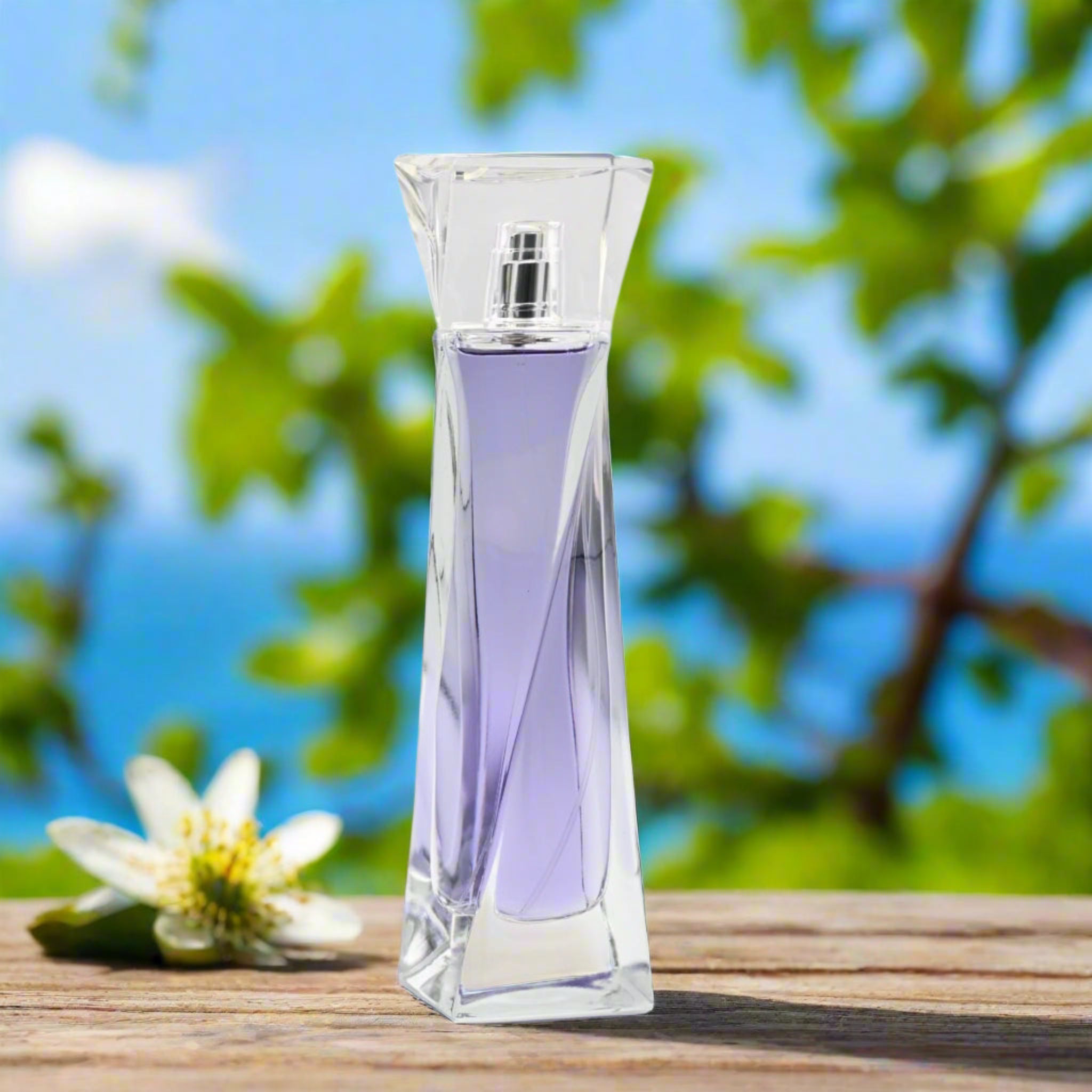 Lancème Hypnôse perfume bottle with a floral background