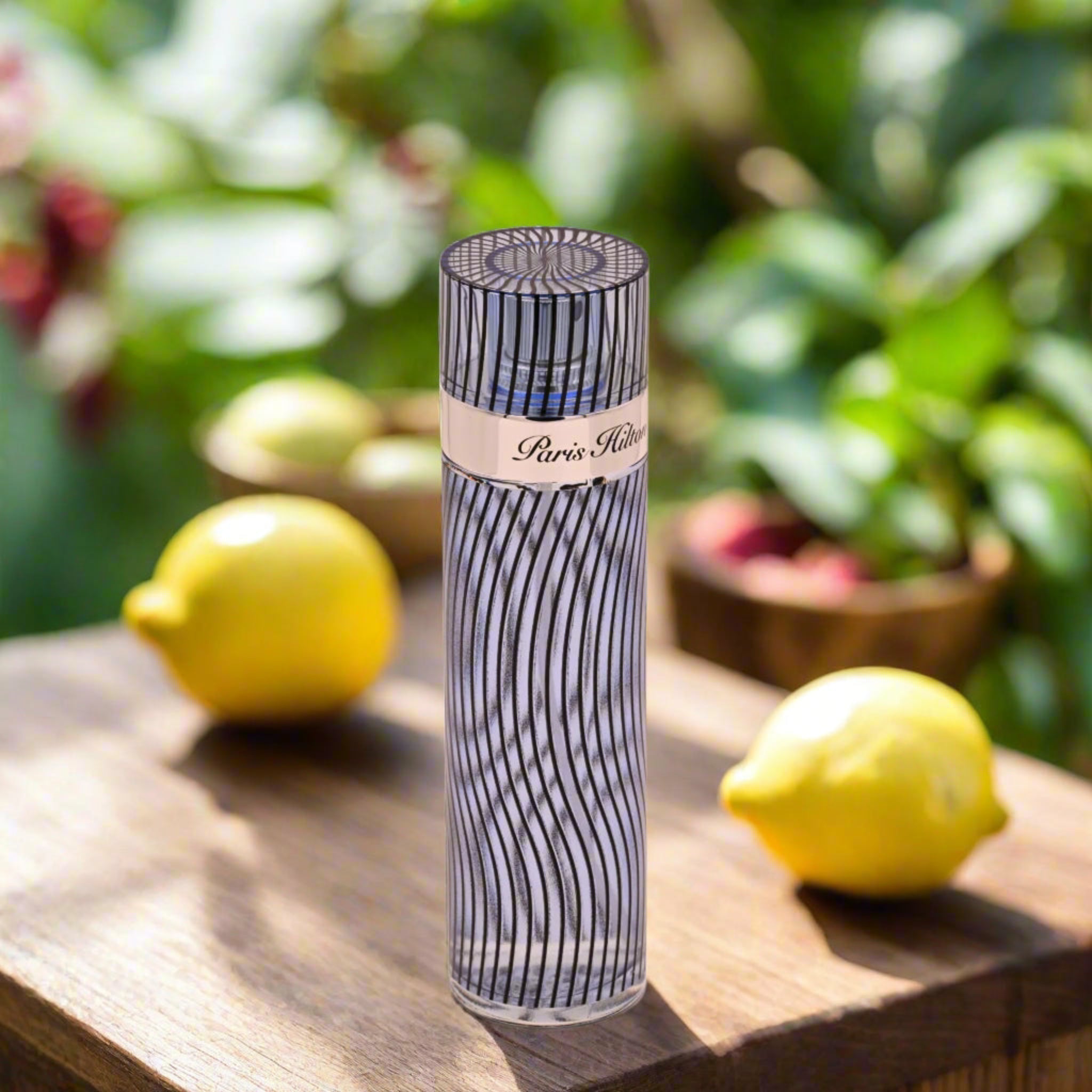 Perfume bottle with wavy design and visible brand name on a white background
