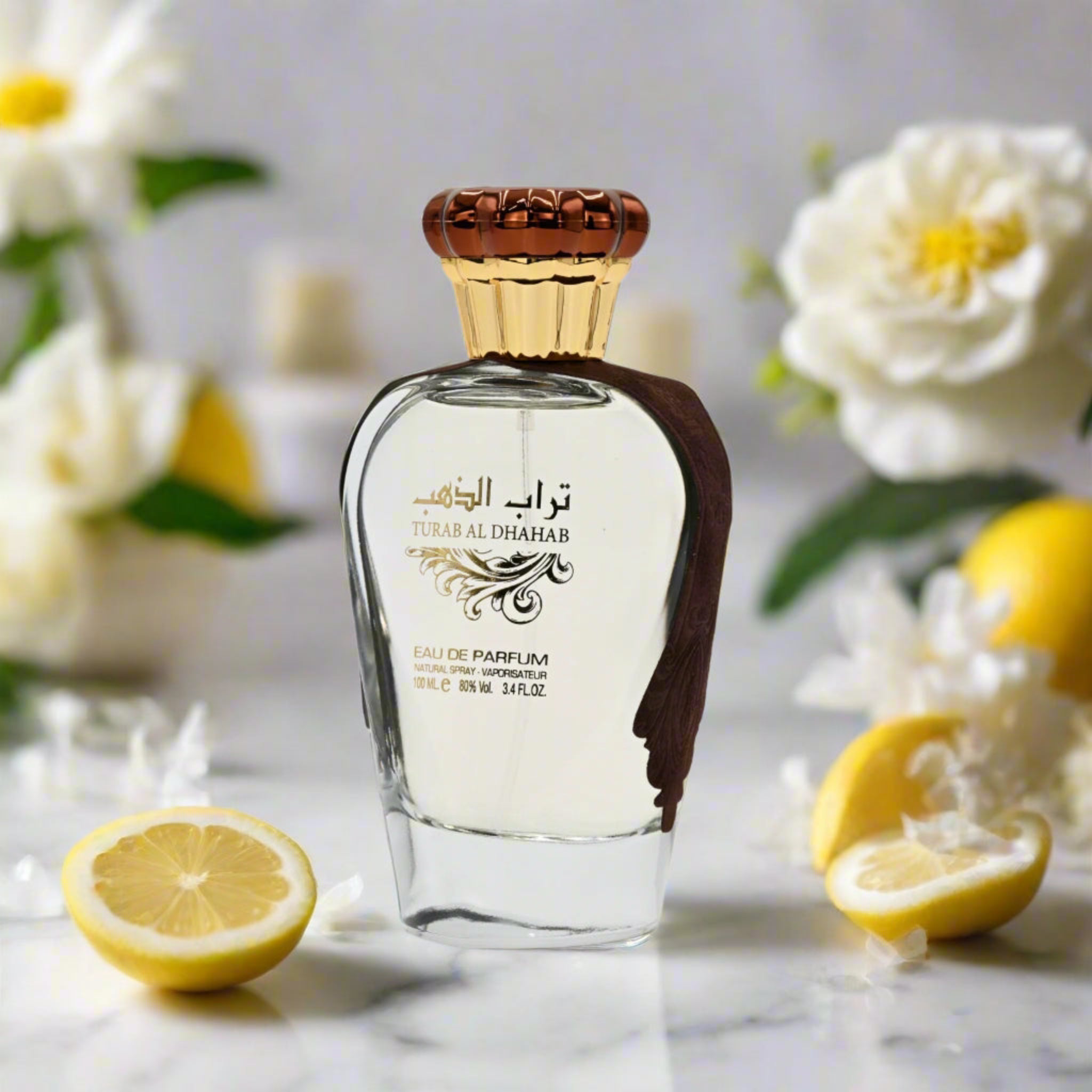 Perfume bottle with decorative cap on a marble surface with lemons and flowers