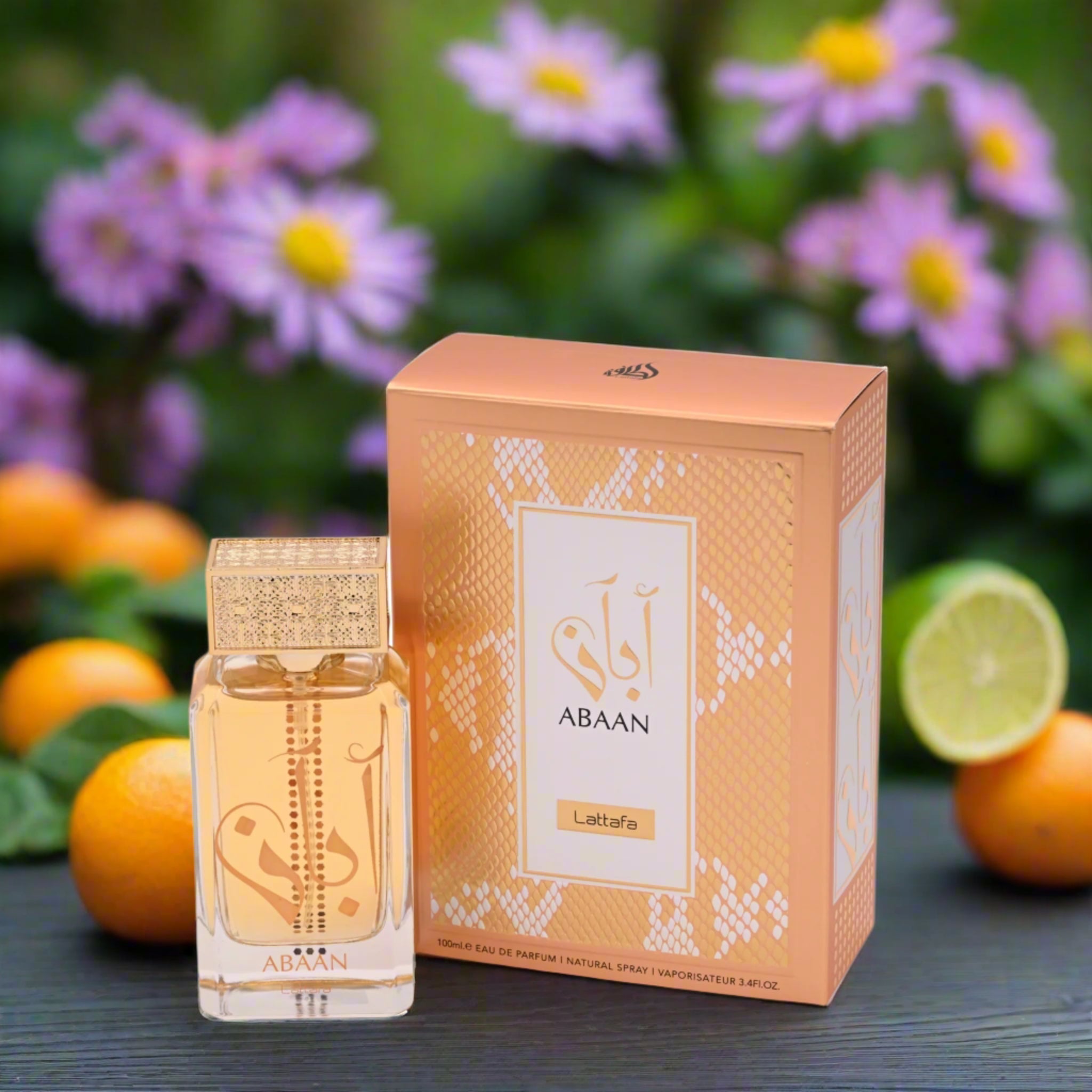 Abaan perfume bottle and packaging on a Garden Bench with Bergamot, Orange.