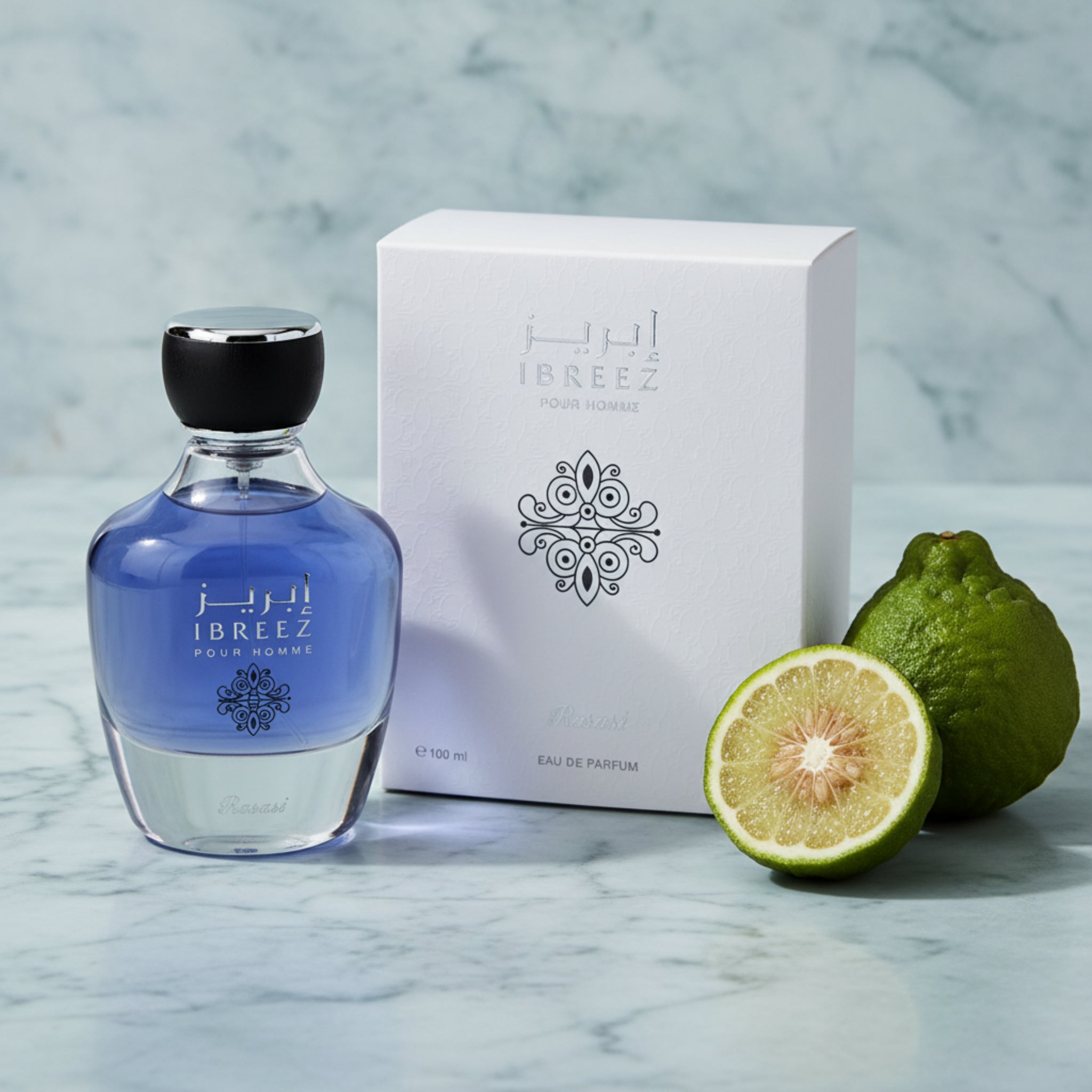 Ibreez perfume bottle and packaging with limes on a marble surface