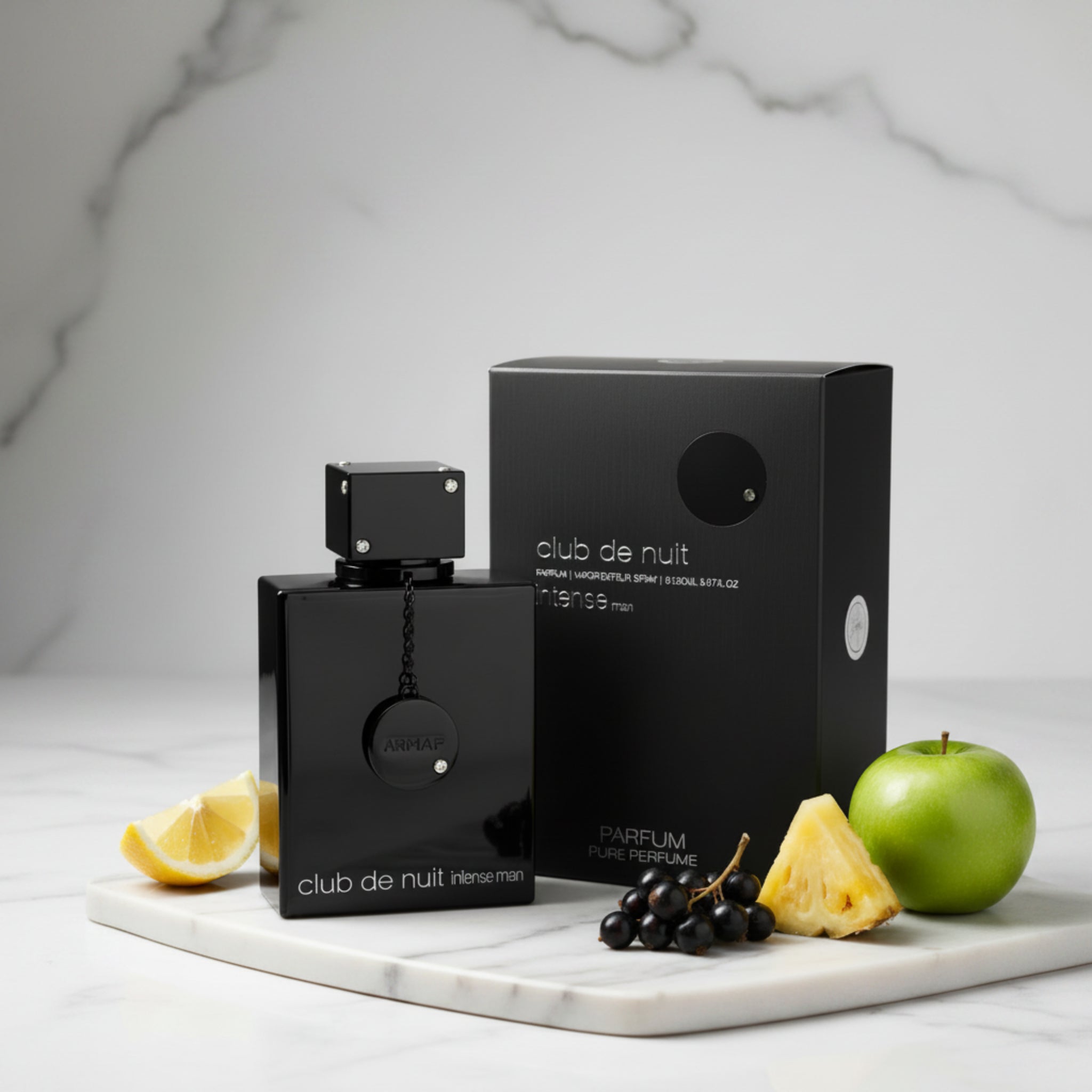 Black perfume bottle and packaging labeled 'club de nuit intense man' on a white background