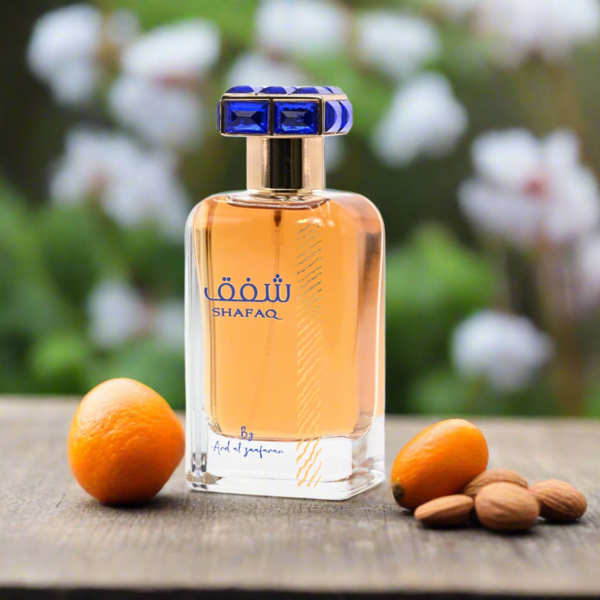 Shafaq perfume bottle with fruits on a wooden surface