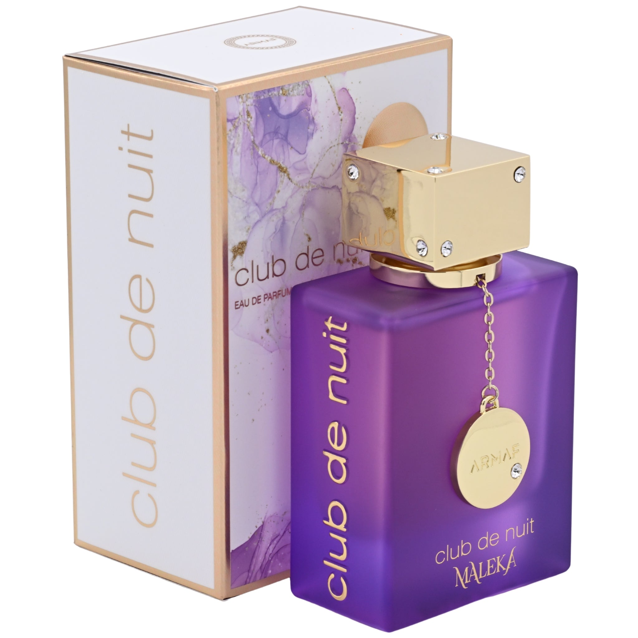 Purple perfume bottle with gold cap and 'club de nuit' branding next to its packaging.