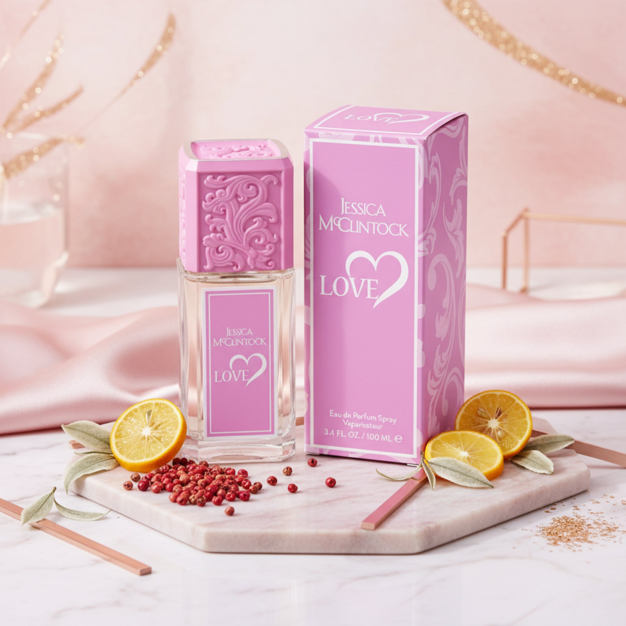 Pink Jessica McClintock Love perfume bottle and packaging on a white background