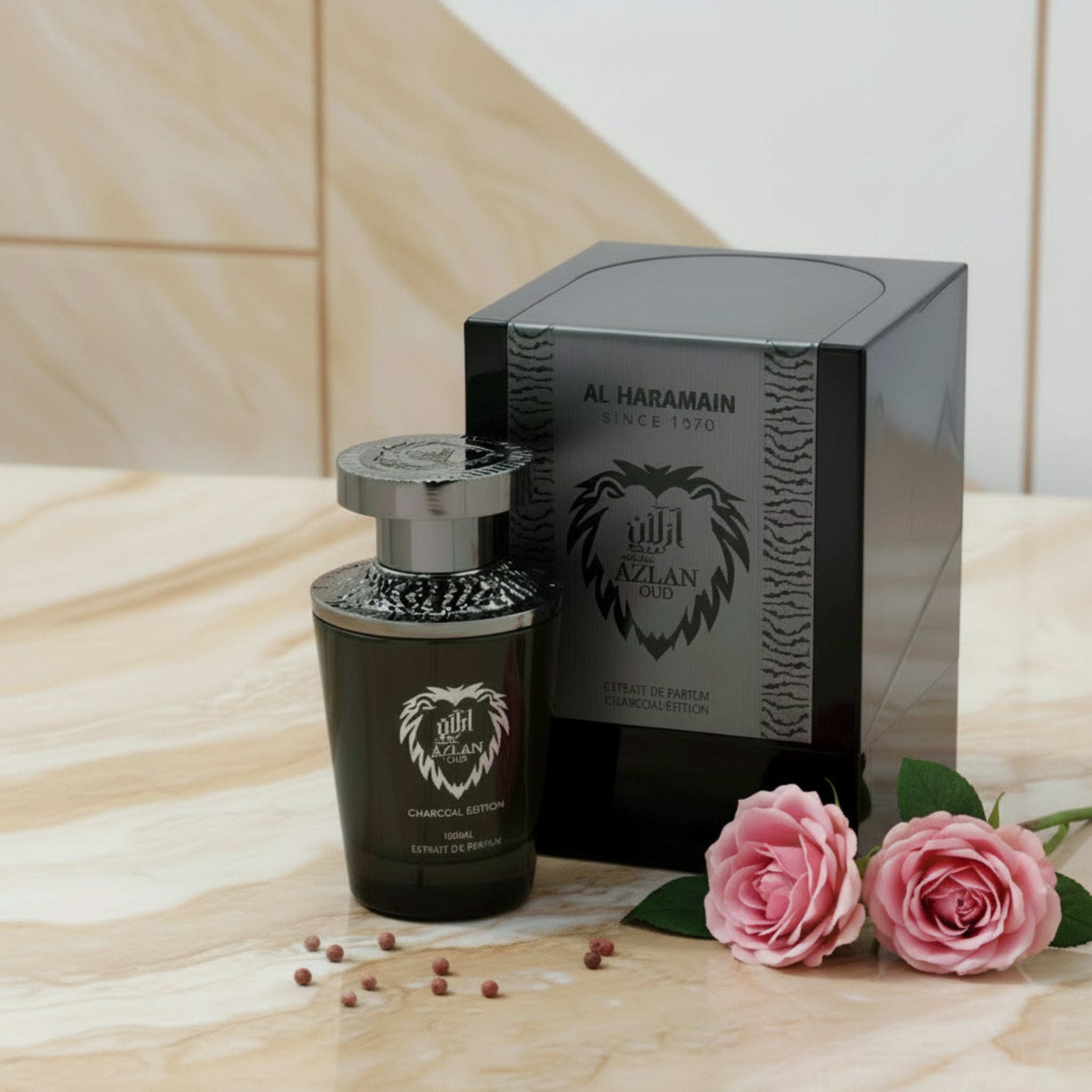 Black perfume bottle and packaging with 'Al Haramain' branding on a white background