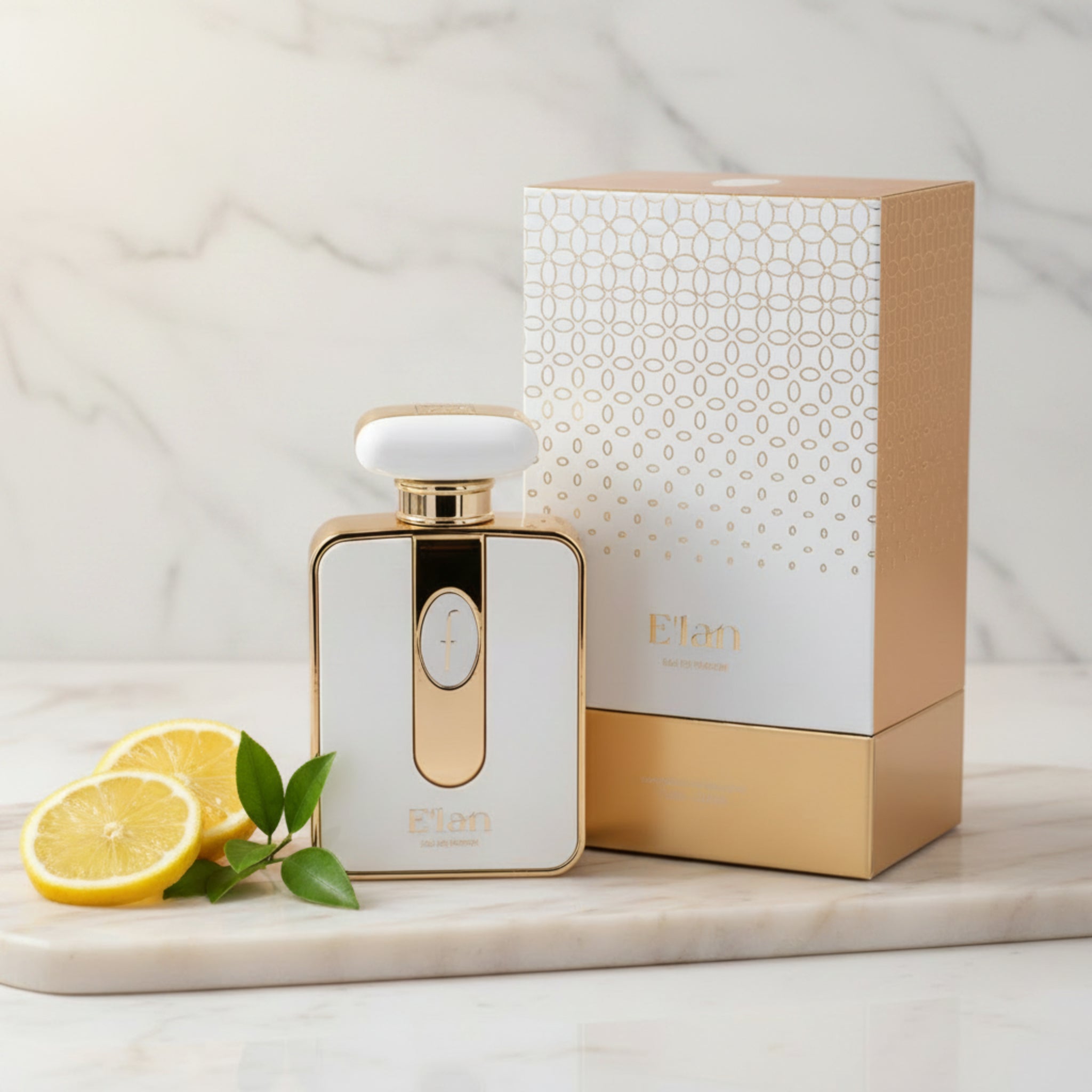 Gold and white perfume bottle with matching box on a white background
