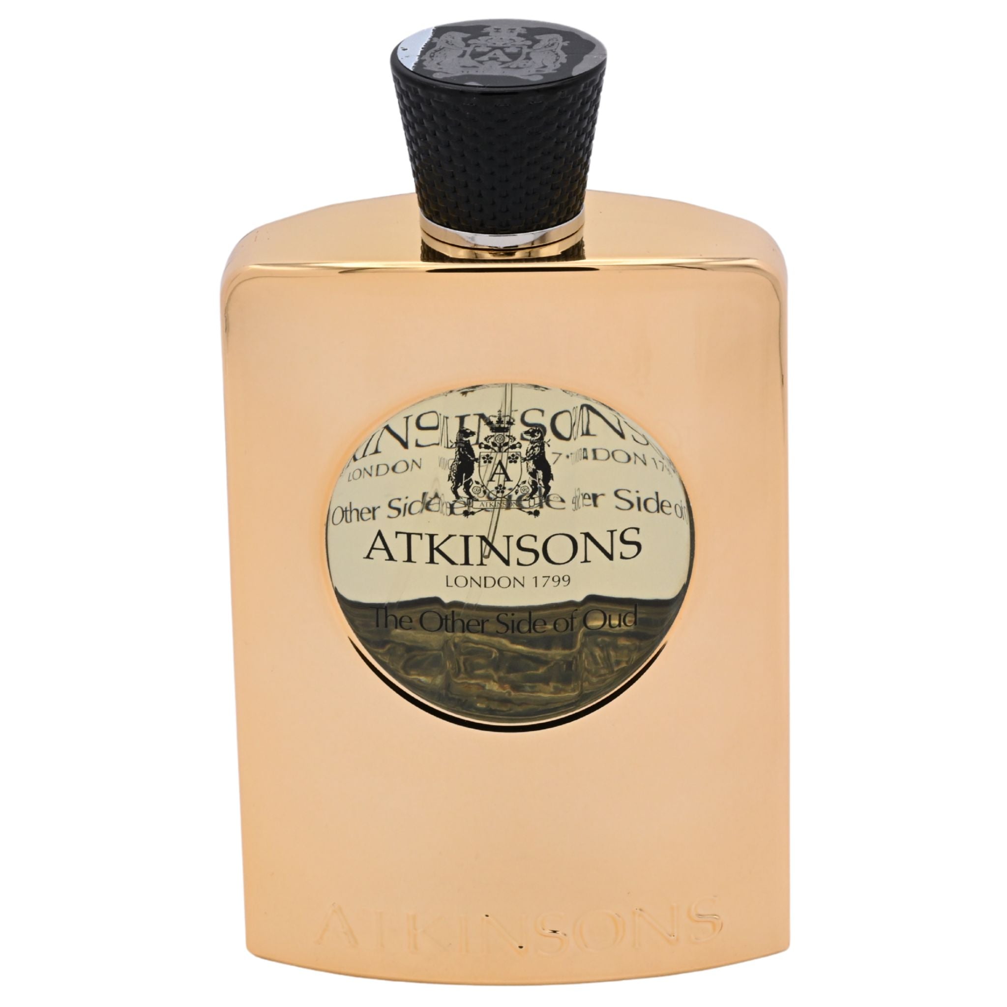 Gold Atkinsons perfume bottle with black cap on a white background
