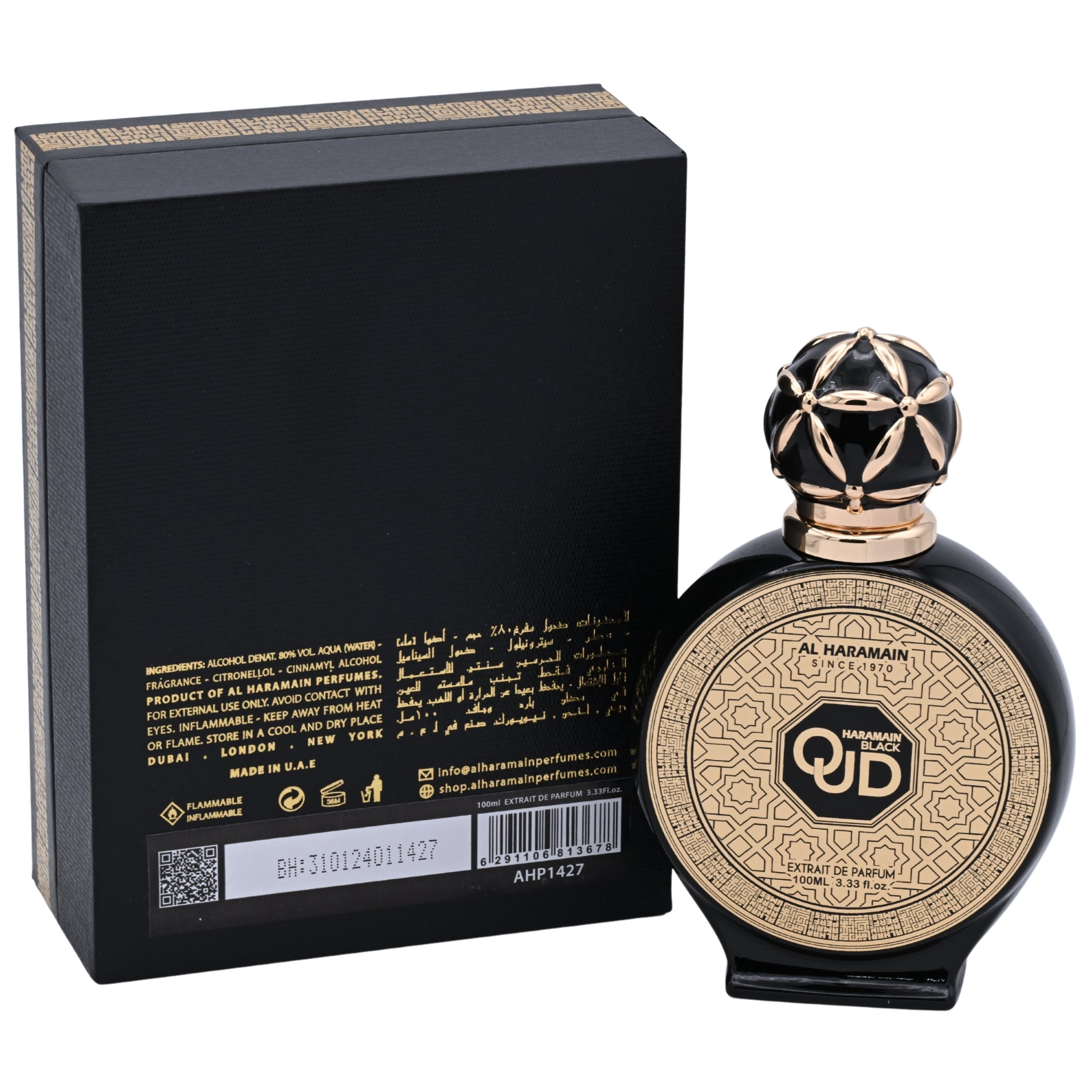 Perfume bottle with geometric design and black and gold packaging next to a black box with gold text.