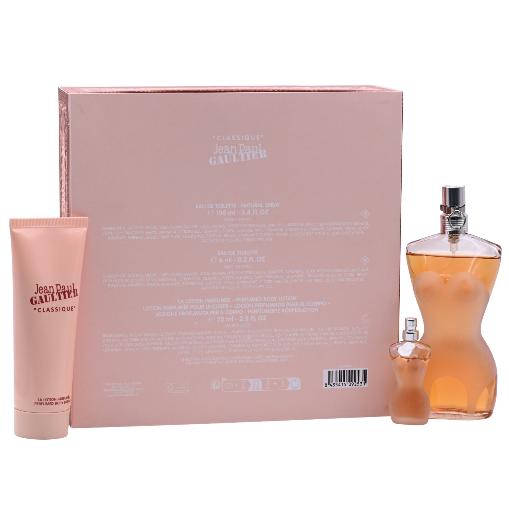 Jean Paul Gaultier perfume set with a large pink box, bottle, and tube on a white background