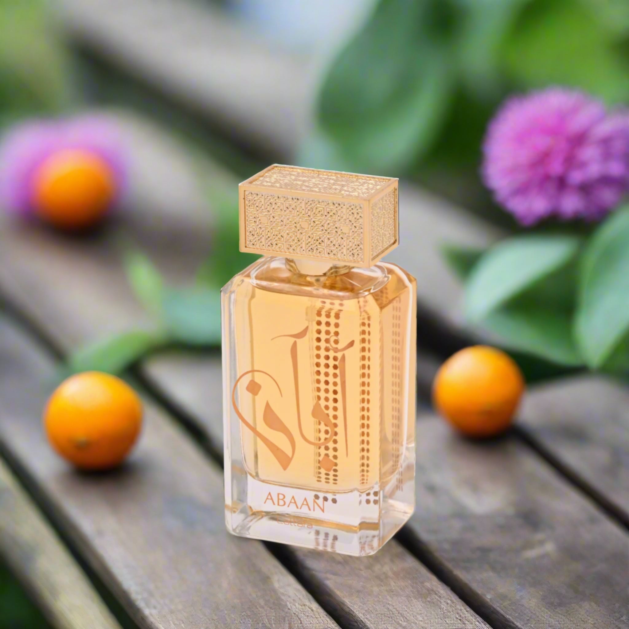 Perfume bottle with gold cap and clear body on a white background