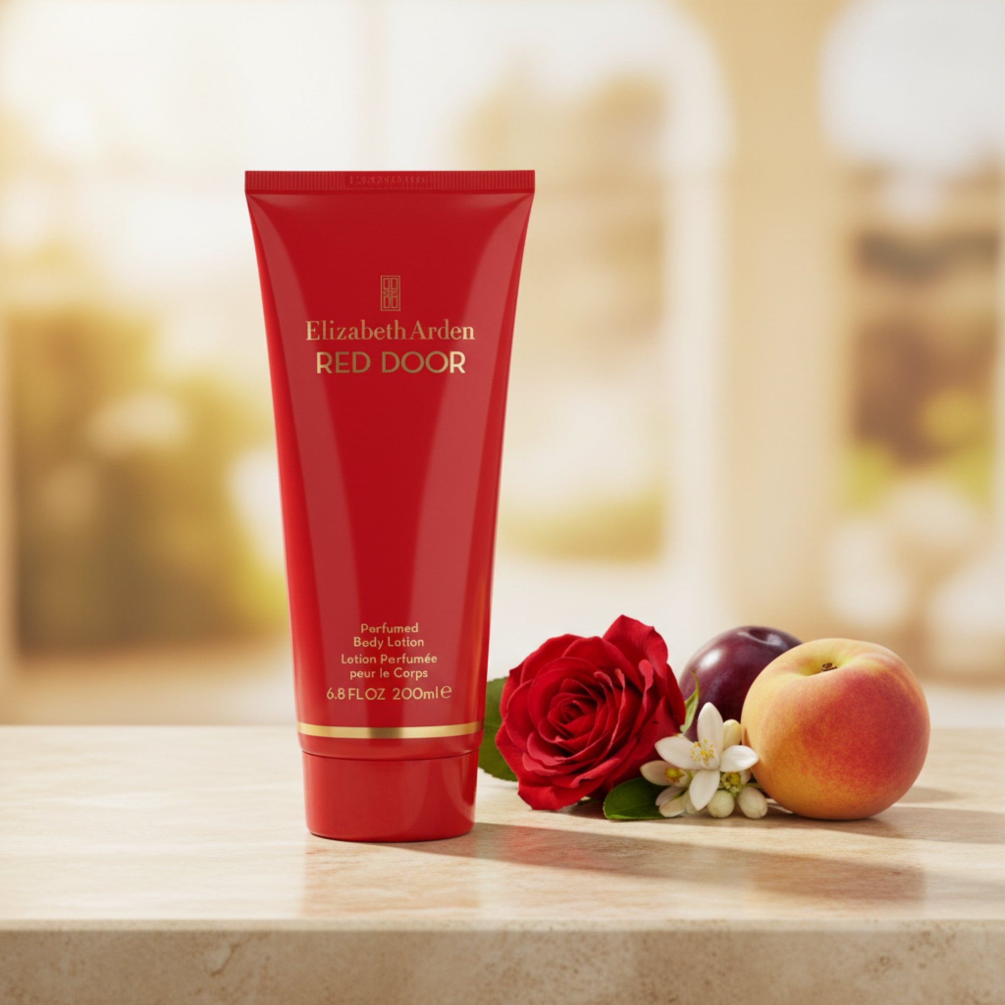 Red tube of Elizabeth Arden Red Door perfume lotion on a white background