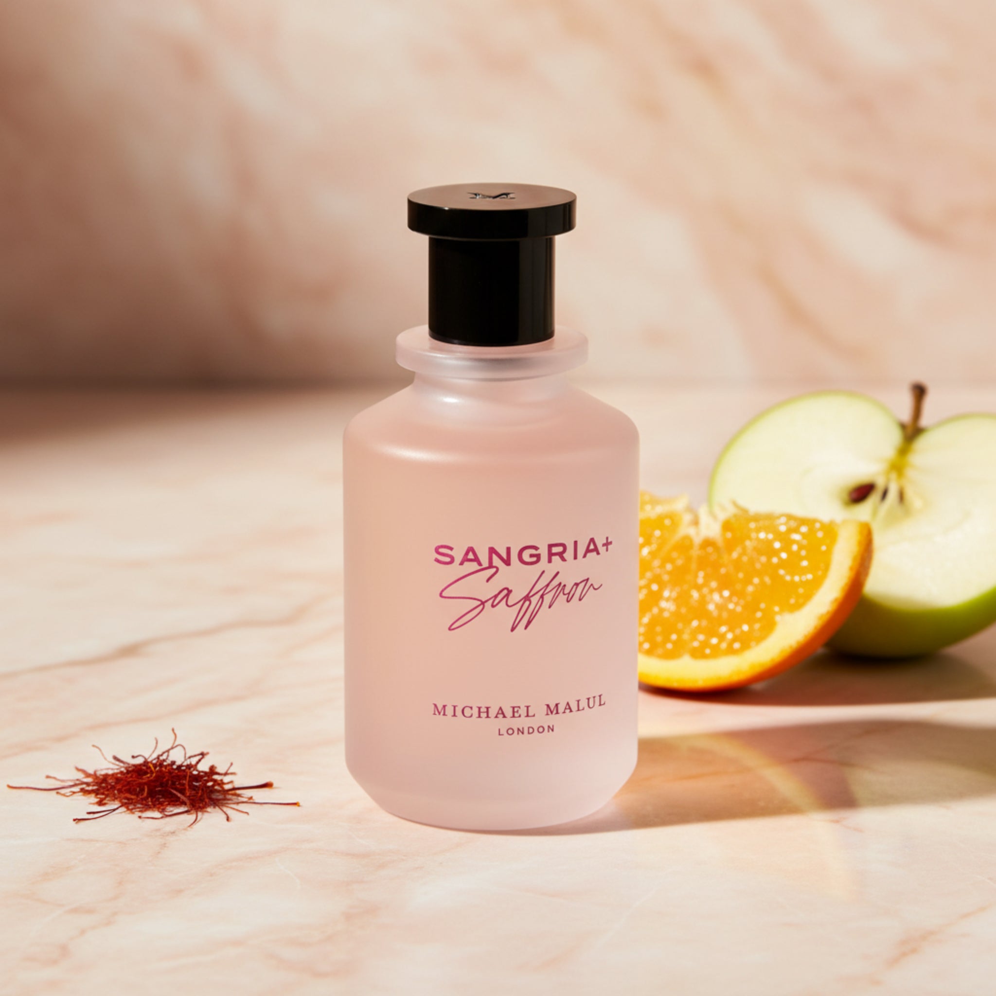 Pink bottle of 'Sangria Saffron' on a white background