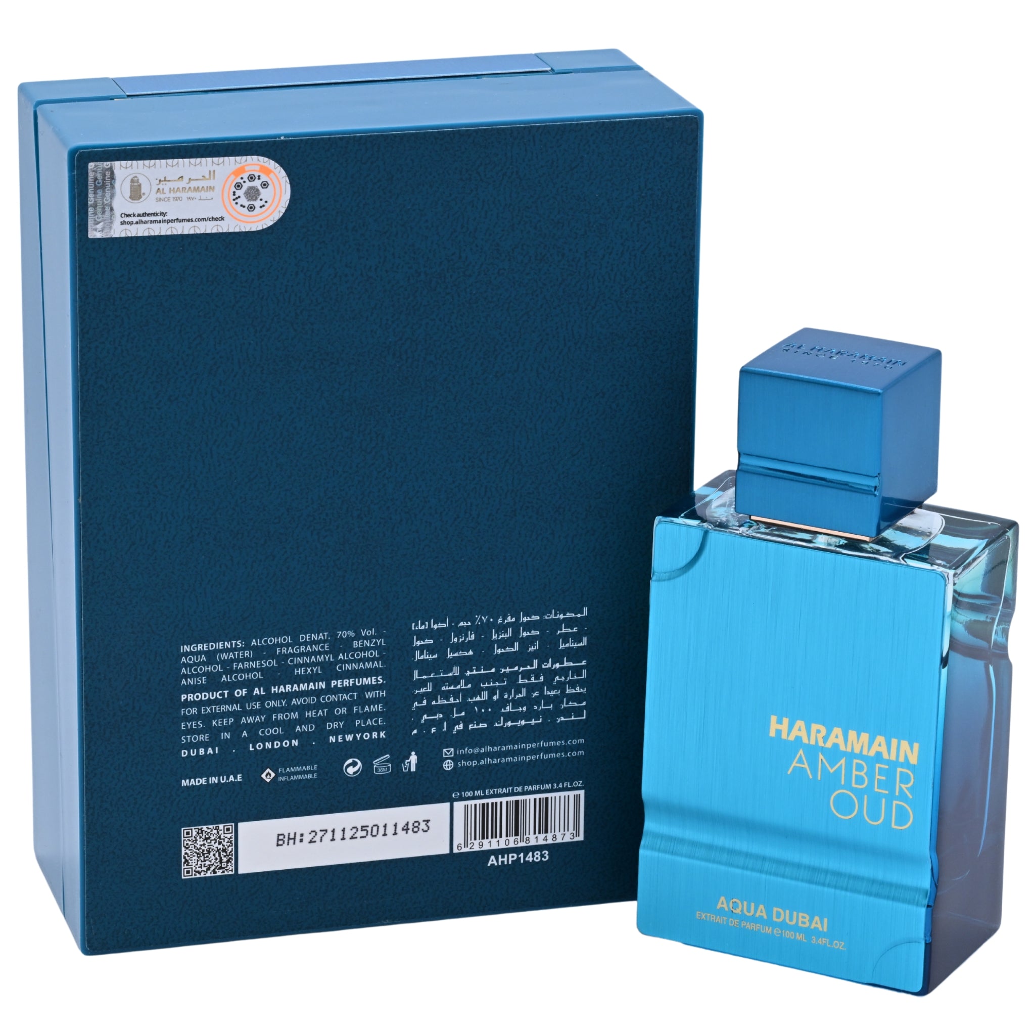 Blue perfume bottle and packaging with 'Haramain Amber Oud' branding on a white background