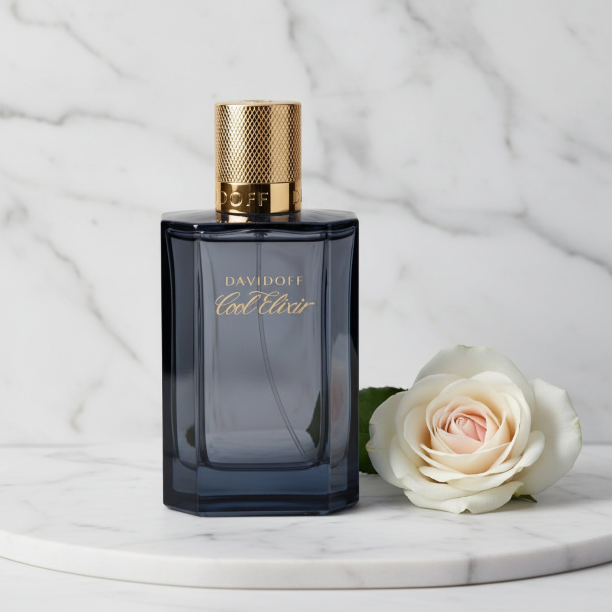 Davidoff Cool Elixir perfume bottle with gold cap on a white background