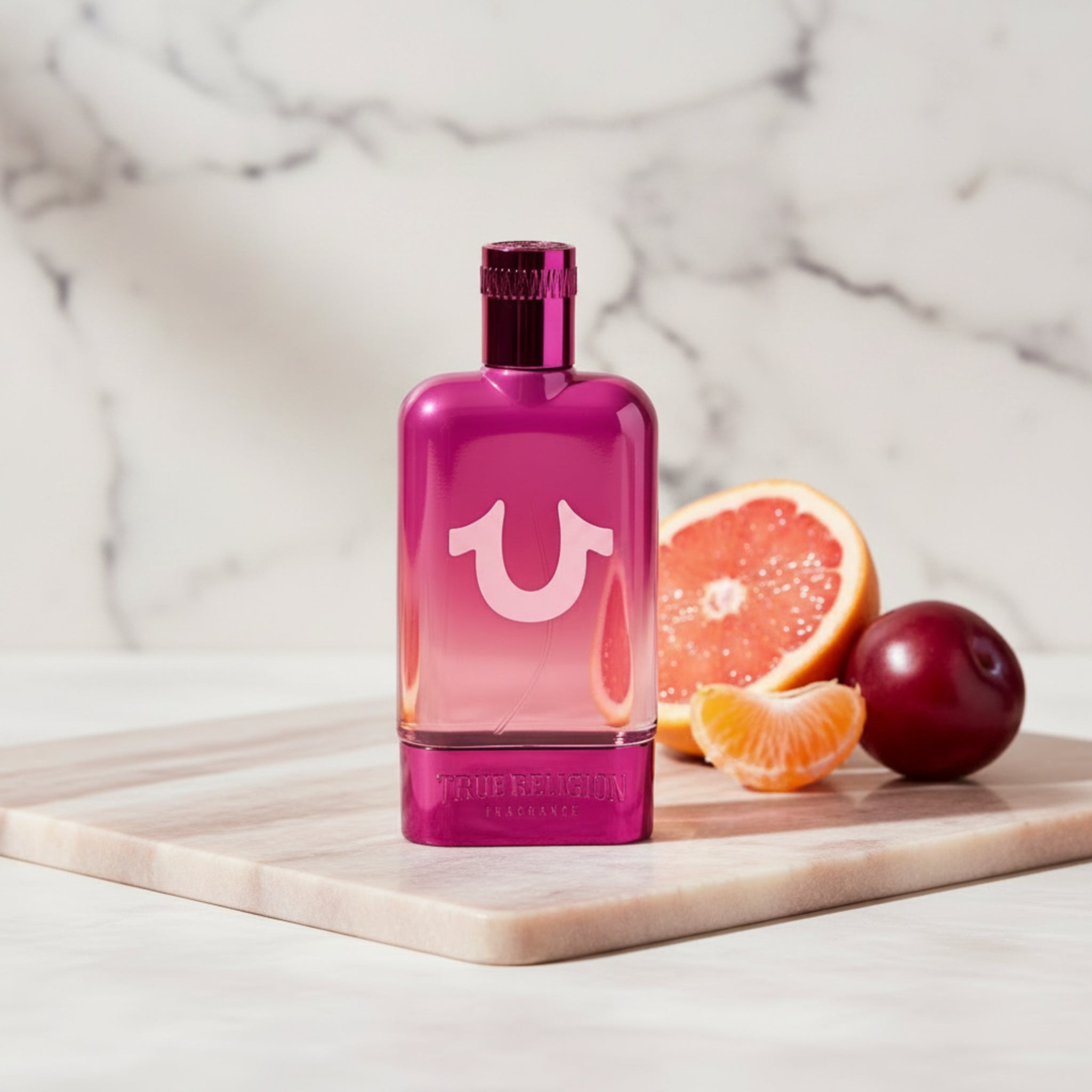 Pink perfume bottle with a visible brand logo on a white background
