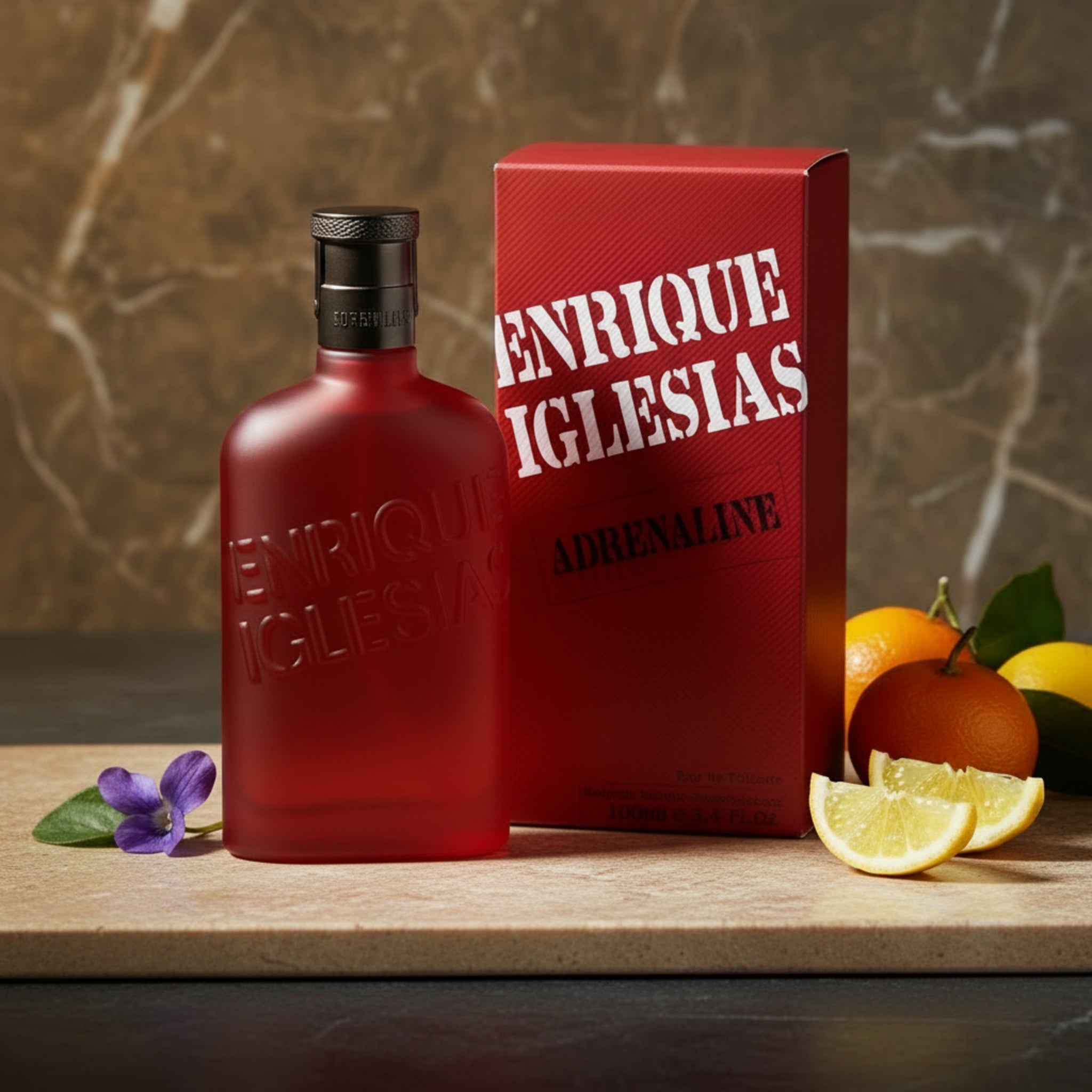 Red Enrique Iglesias Adrenaline perfume bottle and packaging on a white background