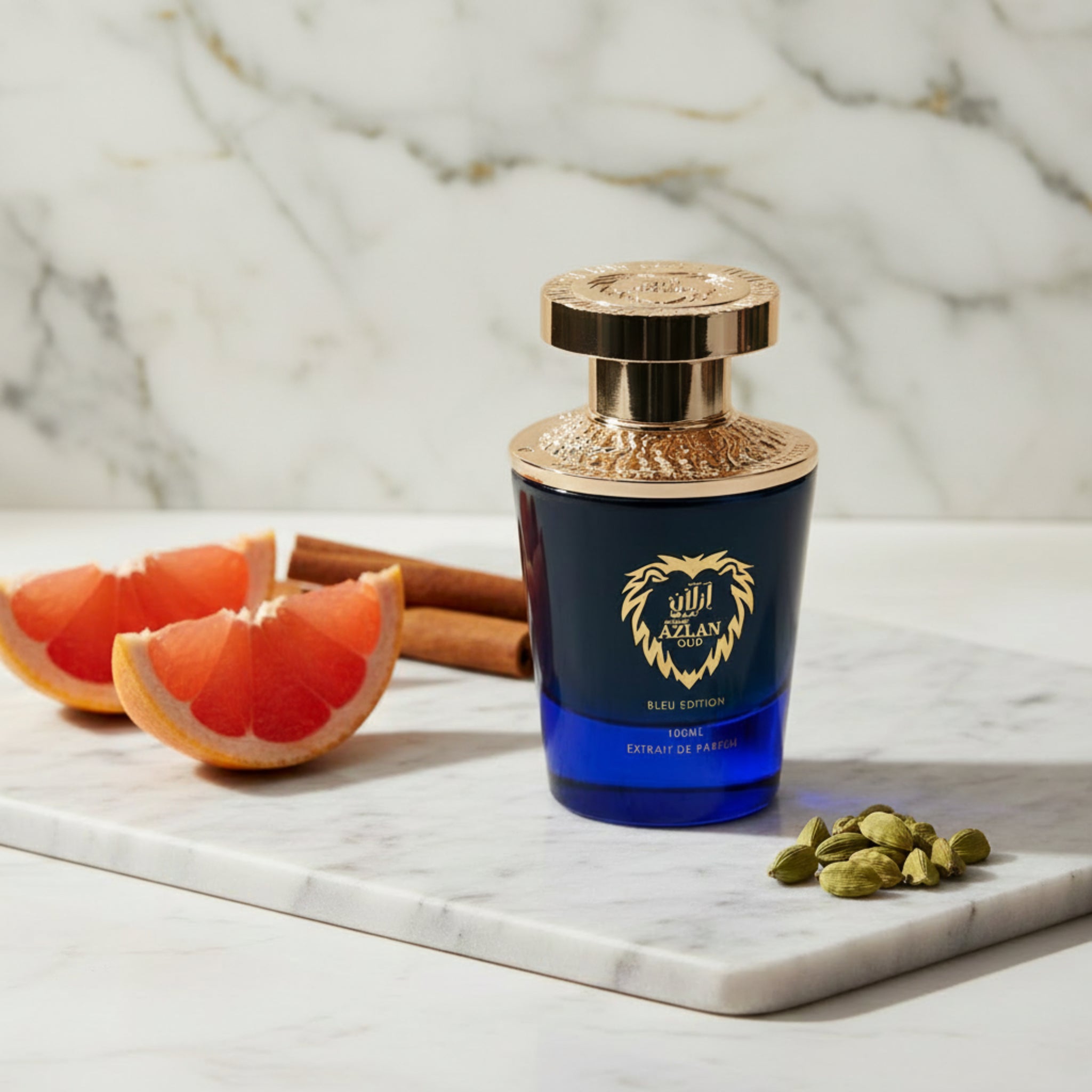Perfume bottle with gold and blue design on a white background