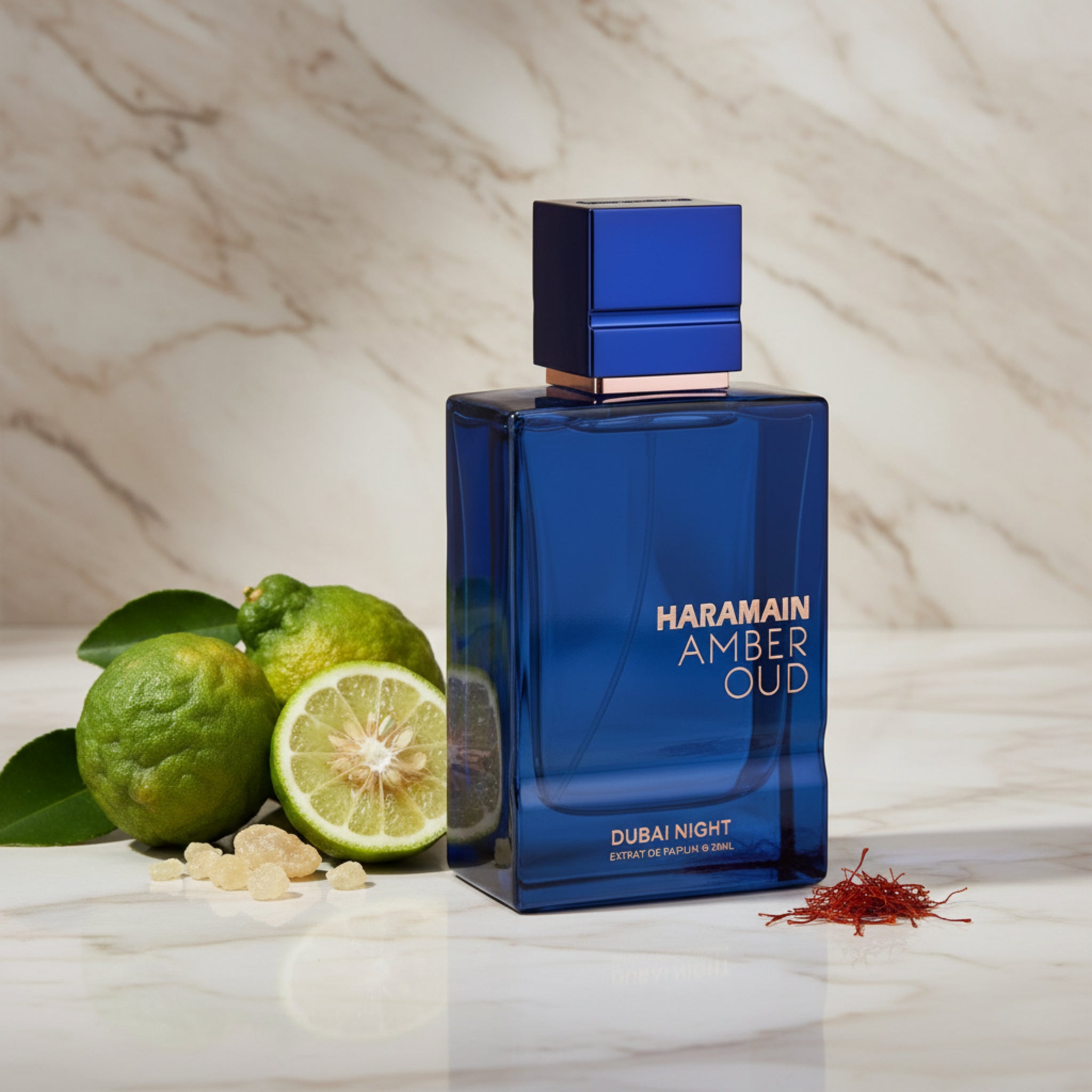 Blue perfume bottle labeled 'Haramain Amber Oud Dubai Night' on a white background