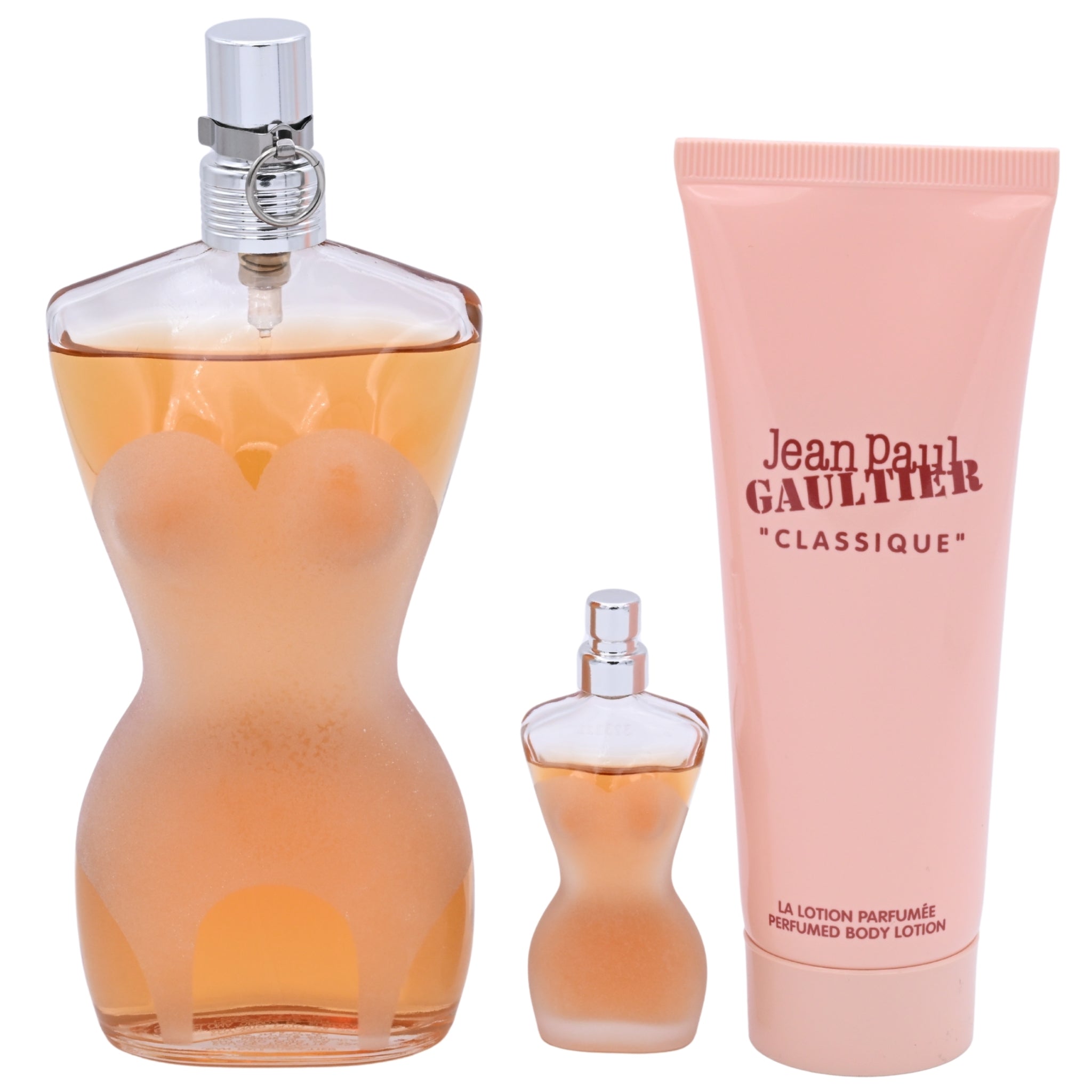 Jean Paul Gaultier perfume set with a large bottle, small spray bottle, and lotion on a white background