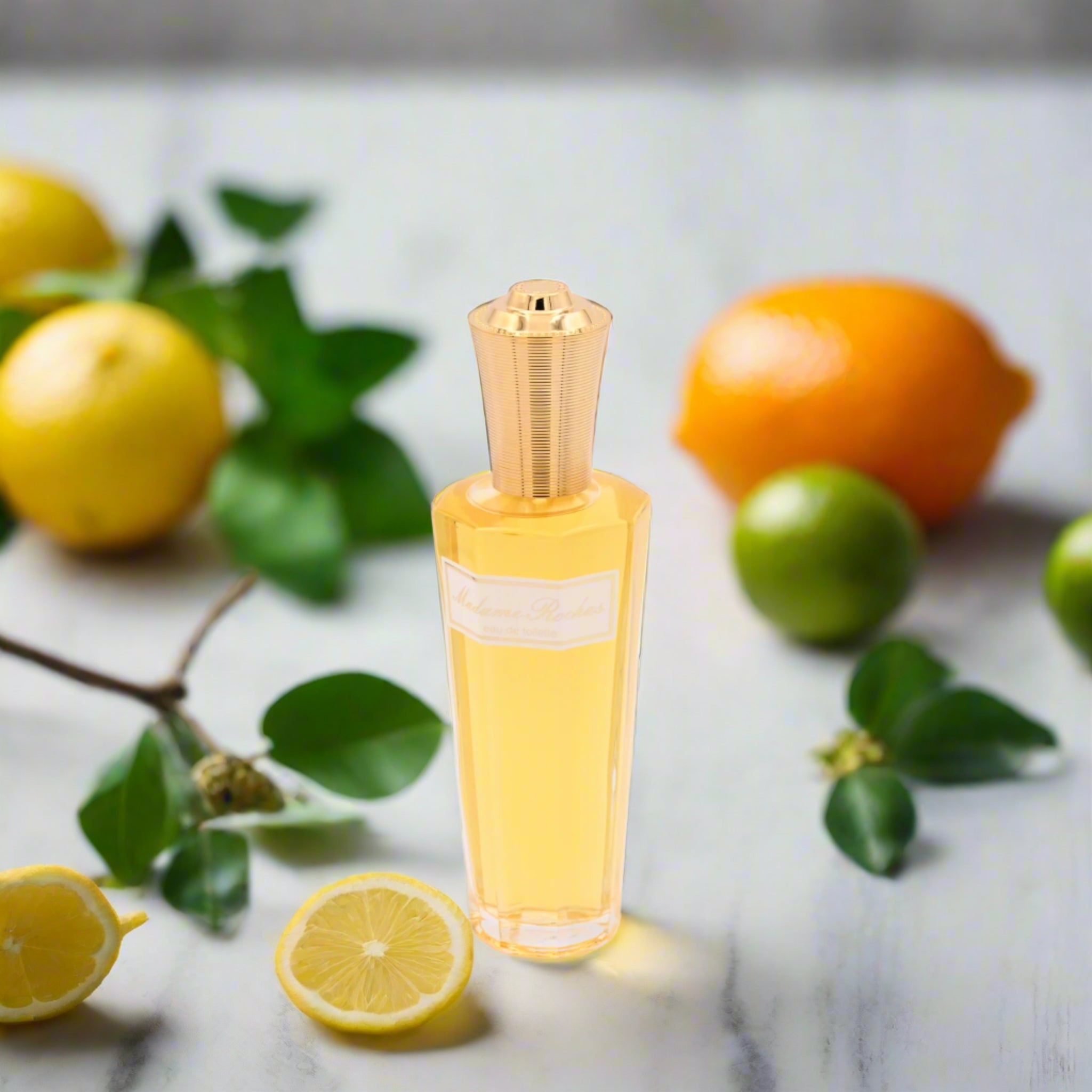 Perfume bottle with gold cap and clear body on a white background