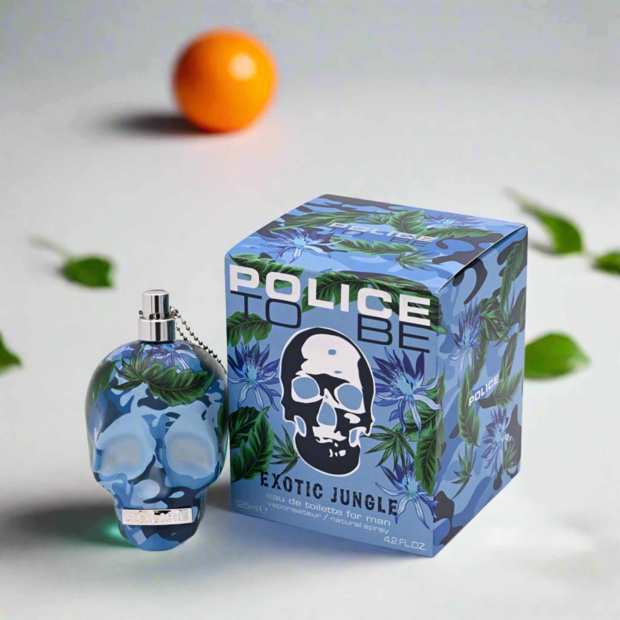 Perfume bottle and packaging with skull design and 'Exotic Jungle' text on a light background.