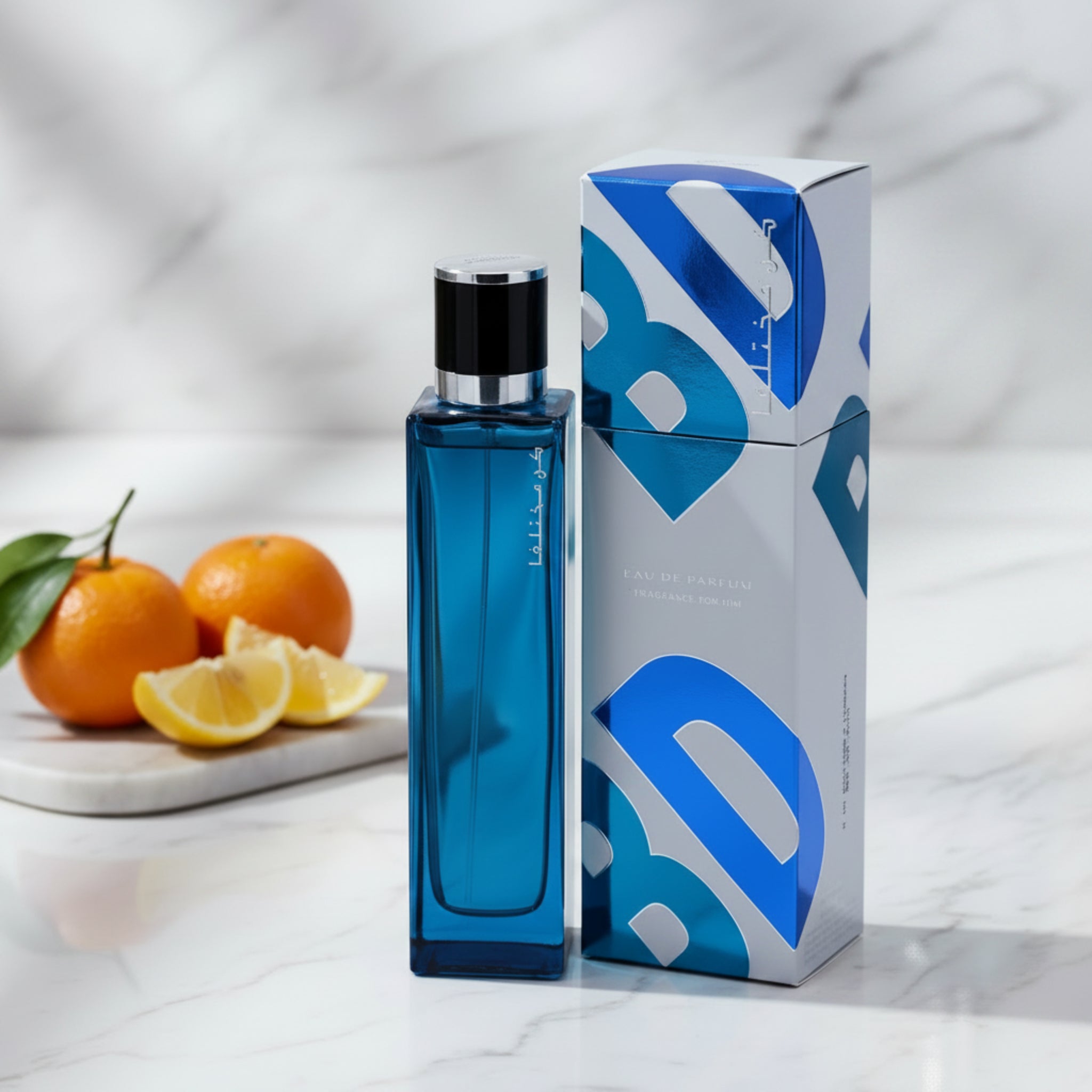 Blue perfume bottle with packaging on a white background