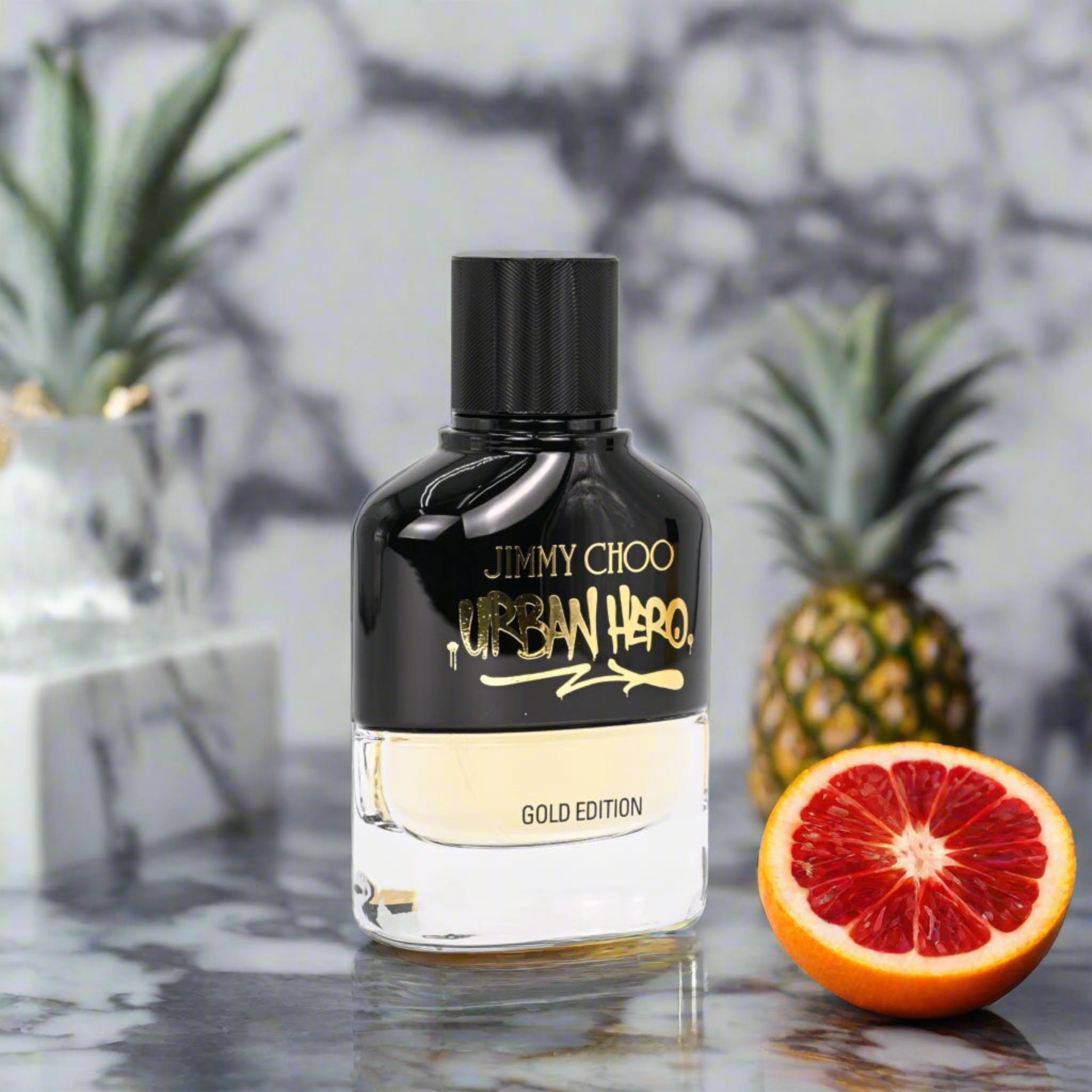 Urban Hero Gold Edition by Jimmy Choo perfume bottle on a blurred background
