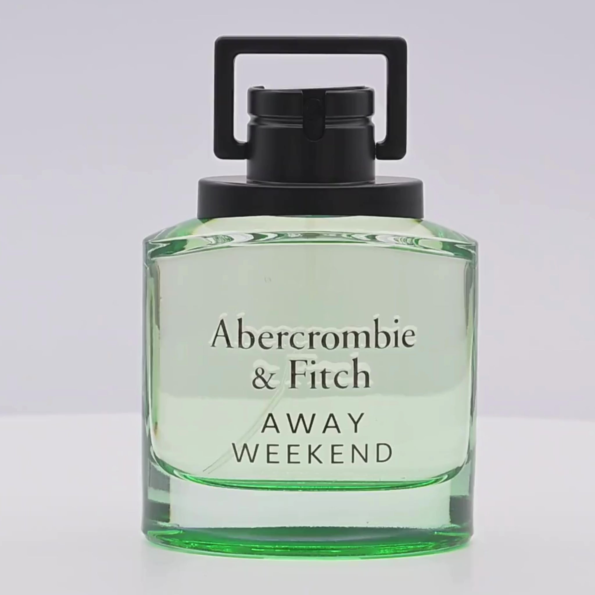 Abercrombie & Fitch perfume bottle rotating on a white podium