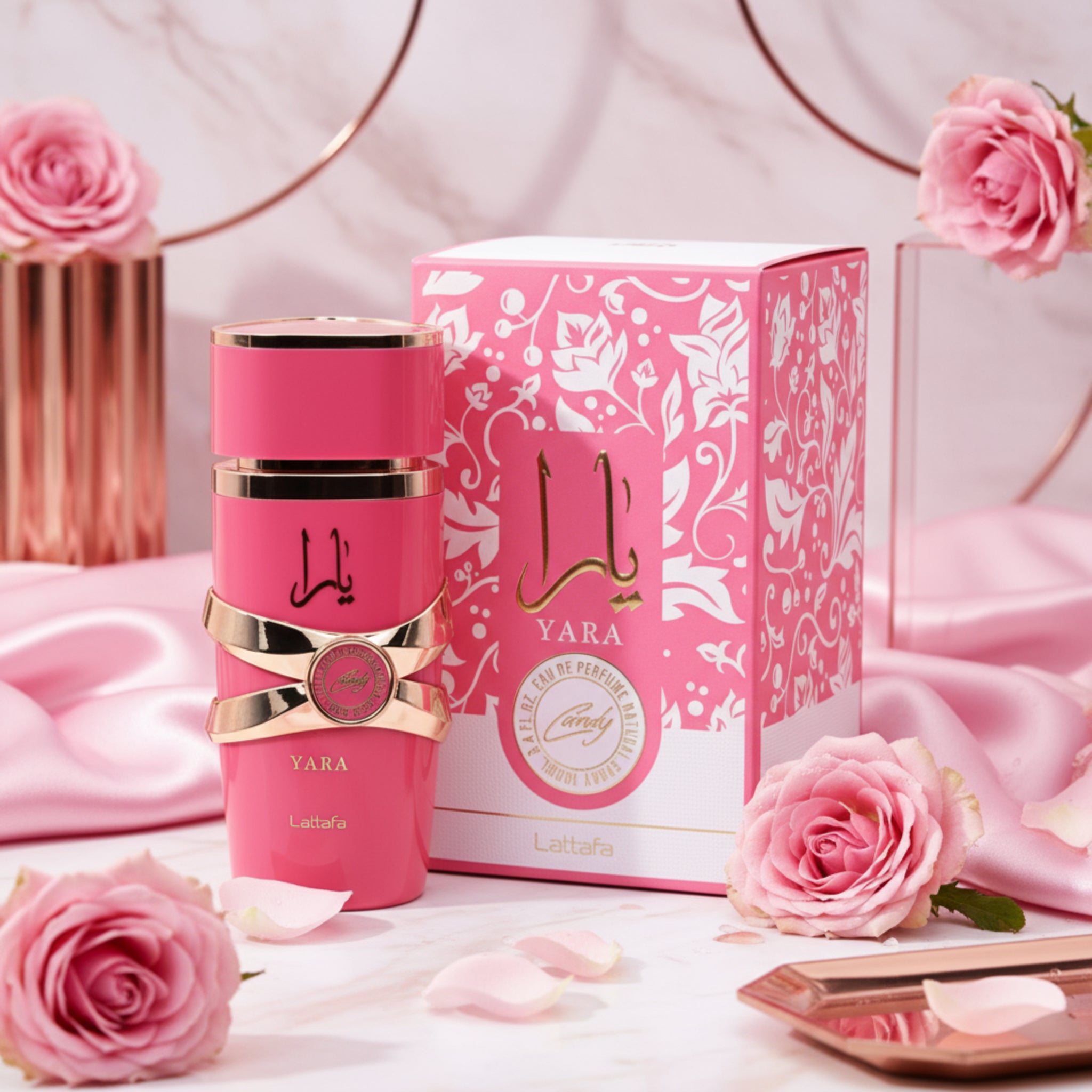 Pink Yara perfume bottle and packaging on a white background