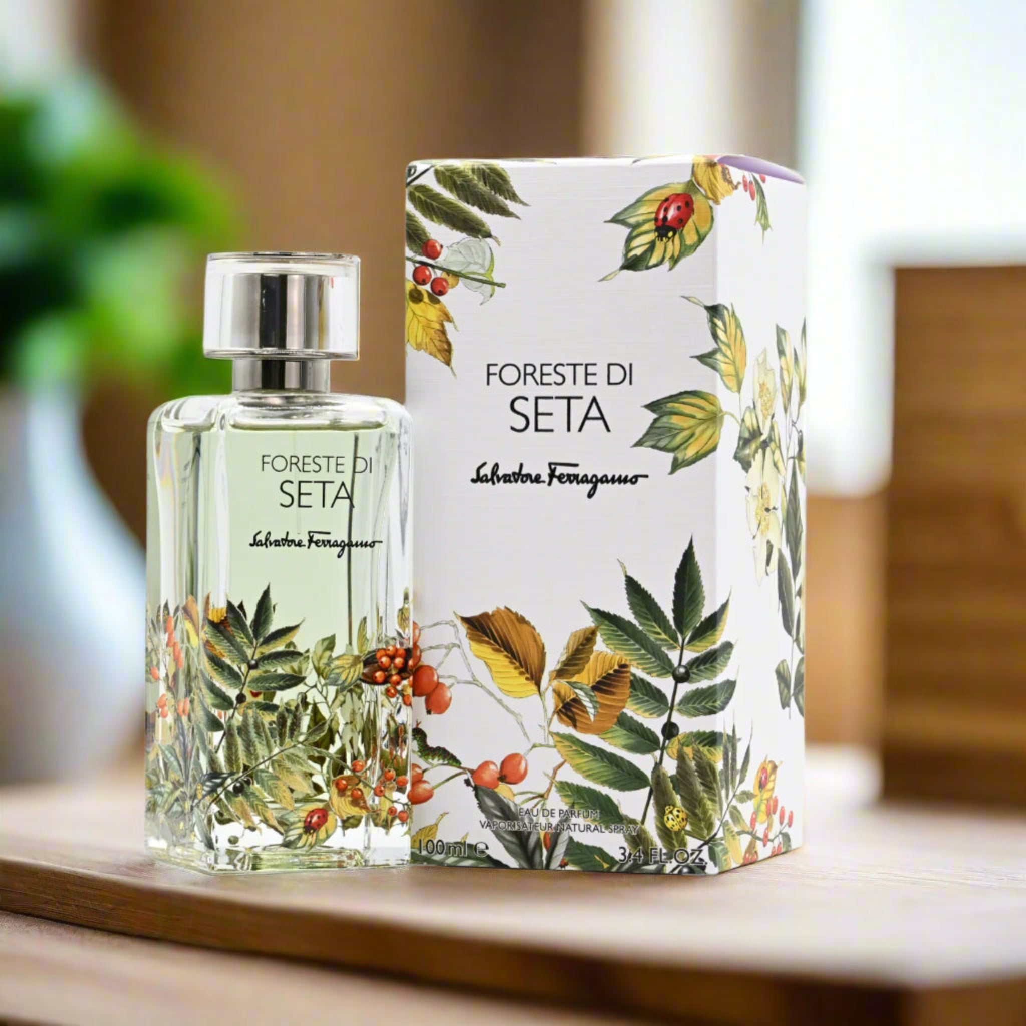Salvatore Ferragamo 'Foreste di Seta' perfume bottle and packaging on a wooden surface.