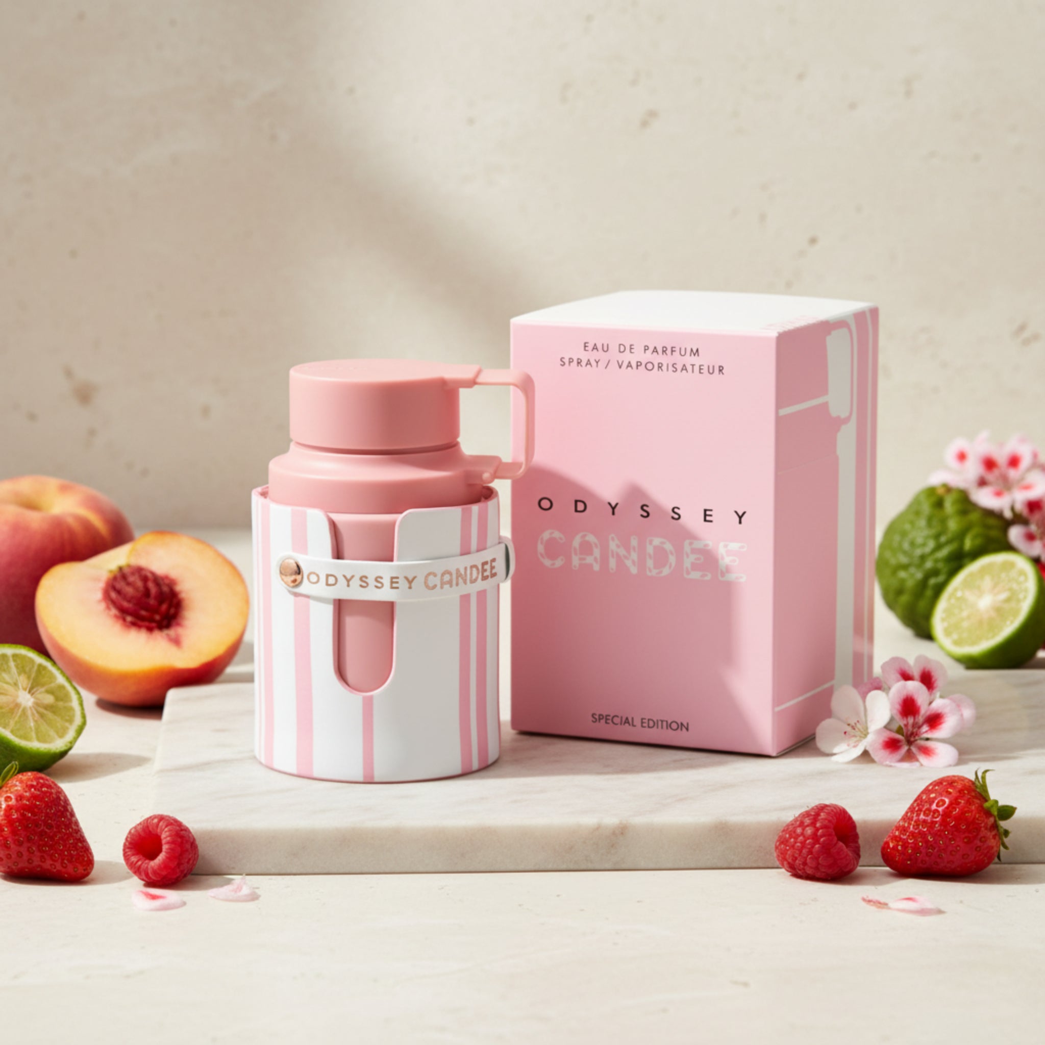 Pink and white Odyssey Candee perfume bottle and packaging on a white background