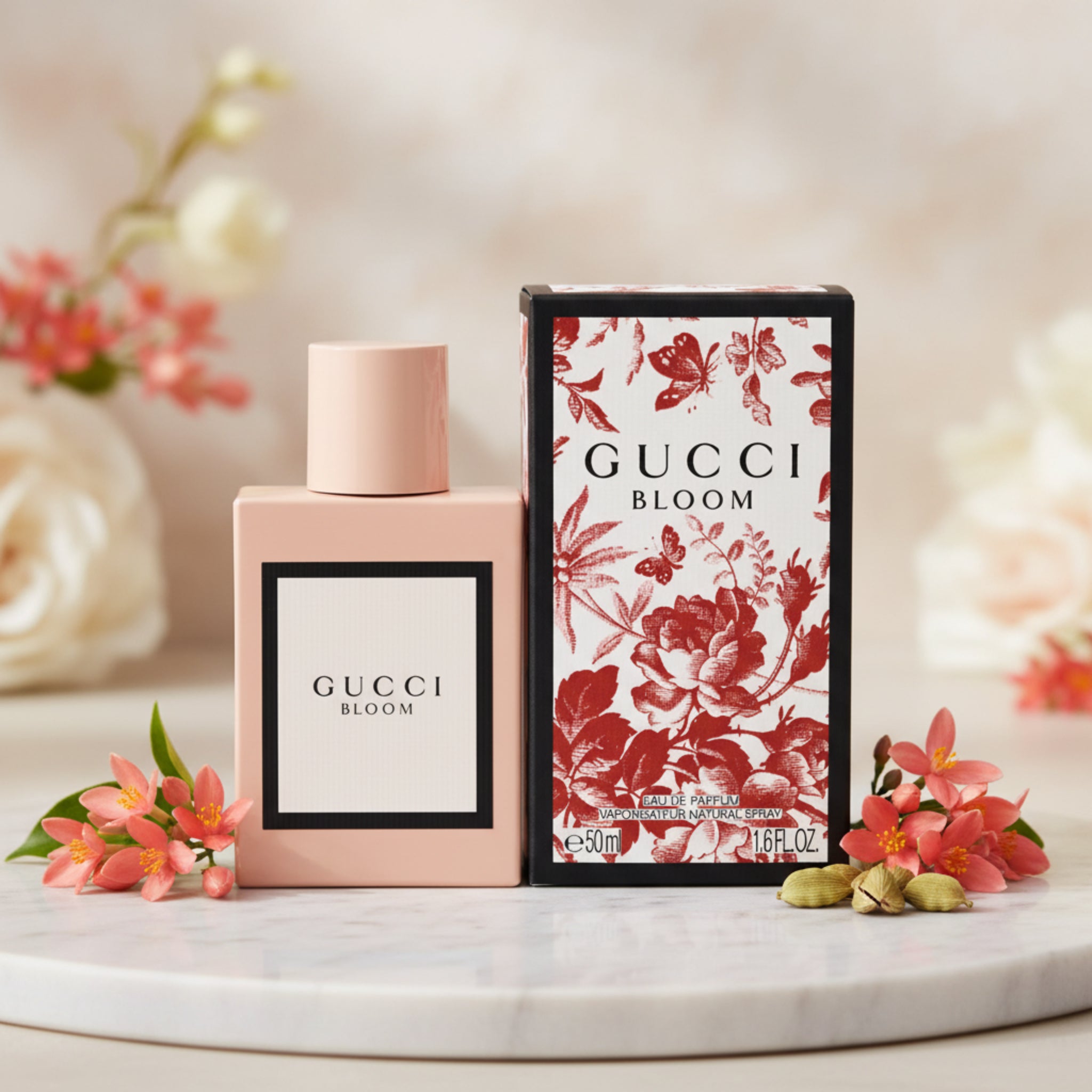 Gucci Bloom perfume bottle and packaging on a white background