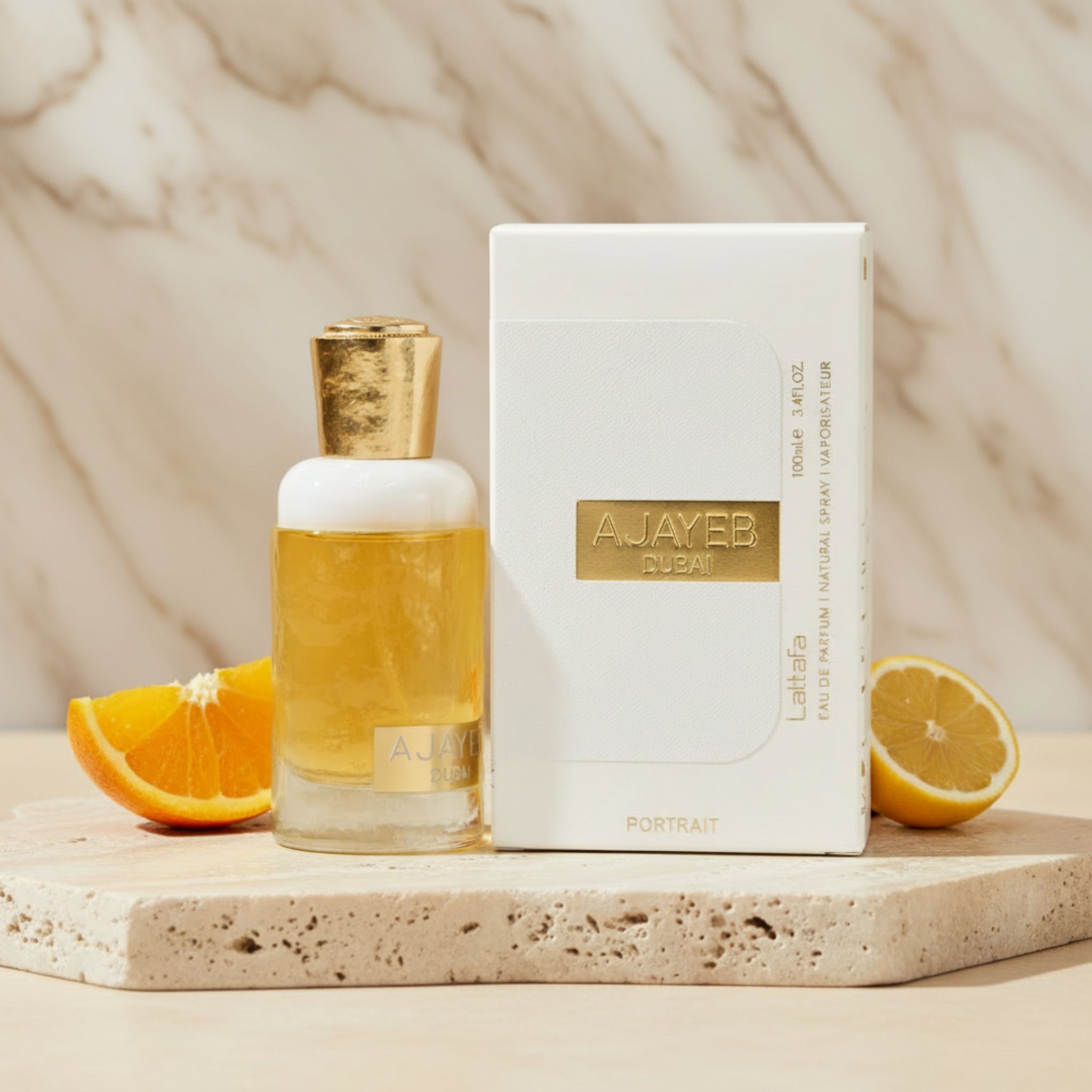 Perfume bottle and packaging with 'Ajayeb Dubai' branding on a white background