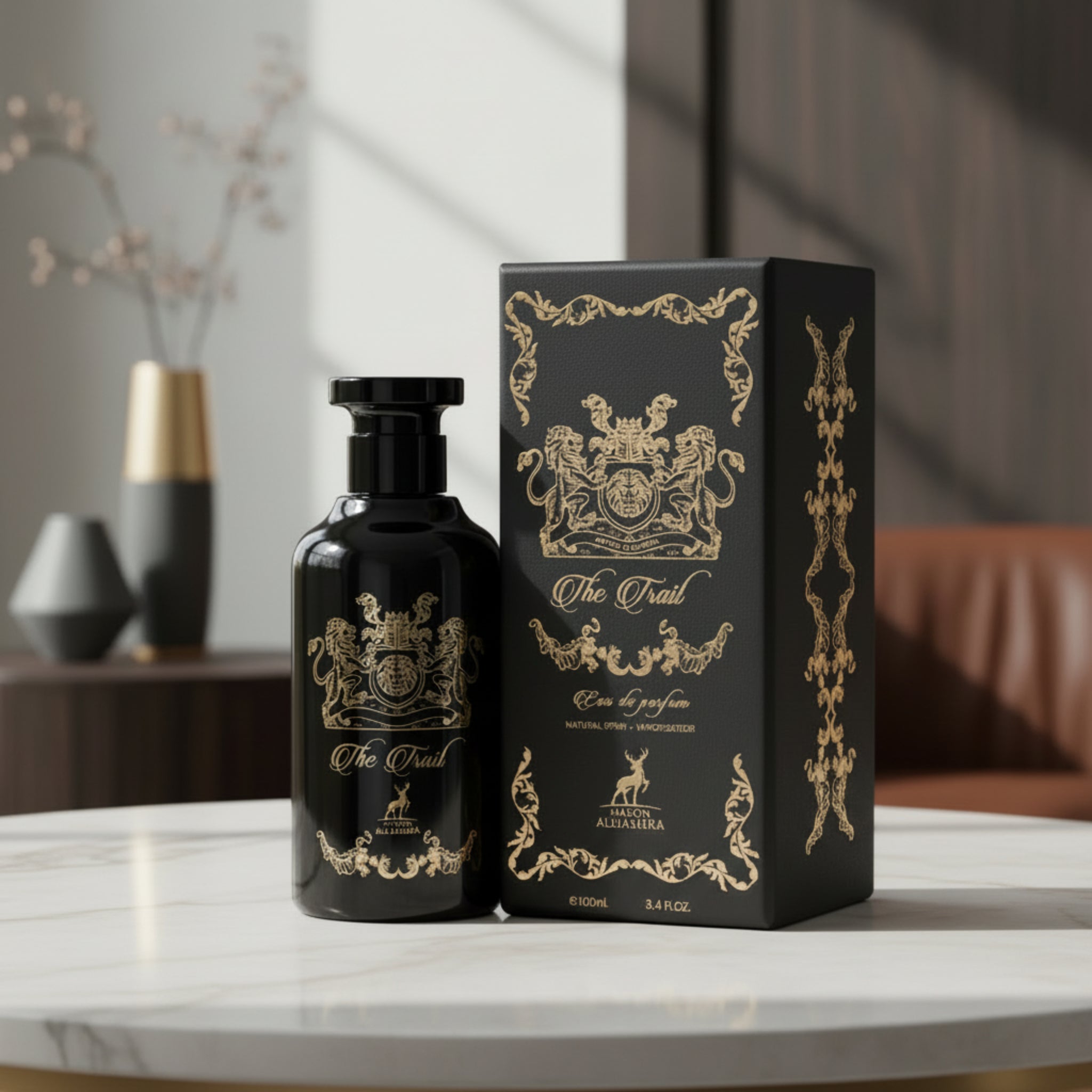 Black perfume bottle and packaging with gold detailing on a white background