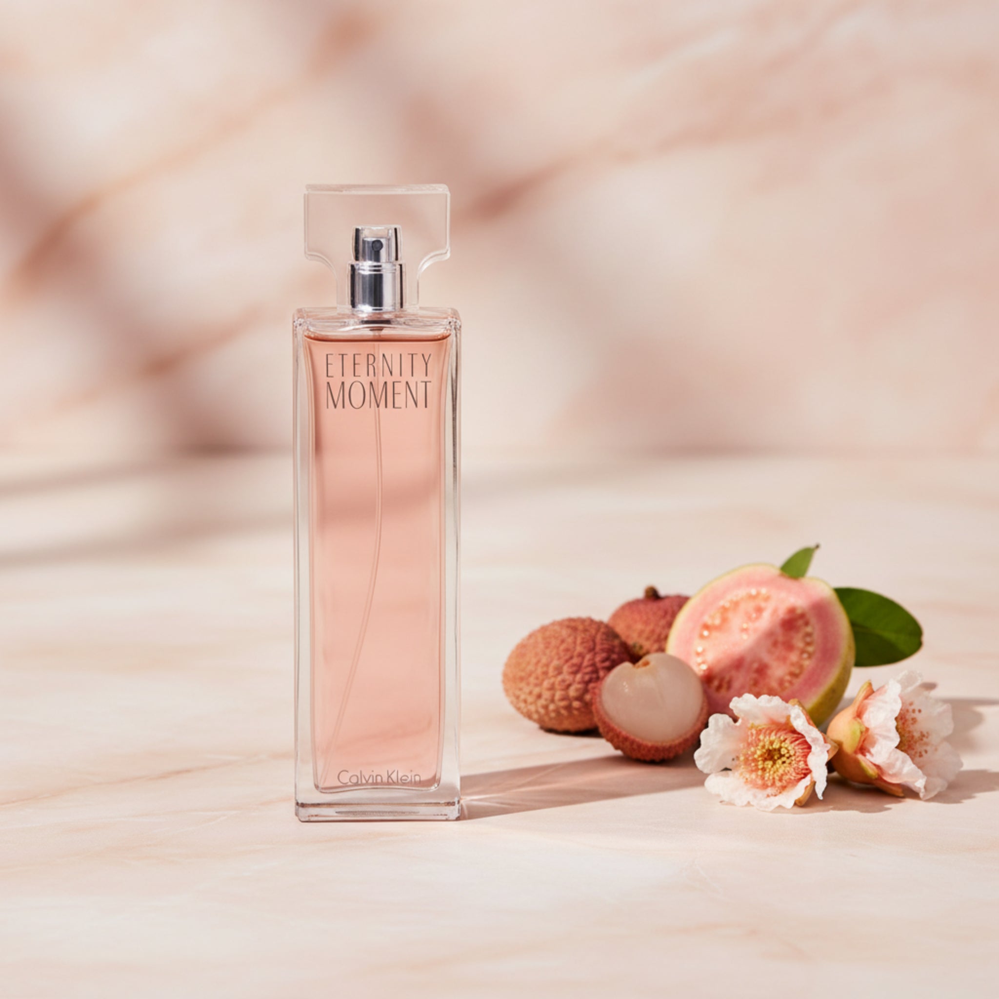Perfume bottle labeled 'Eternity Moment' on a white background