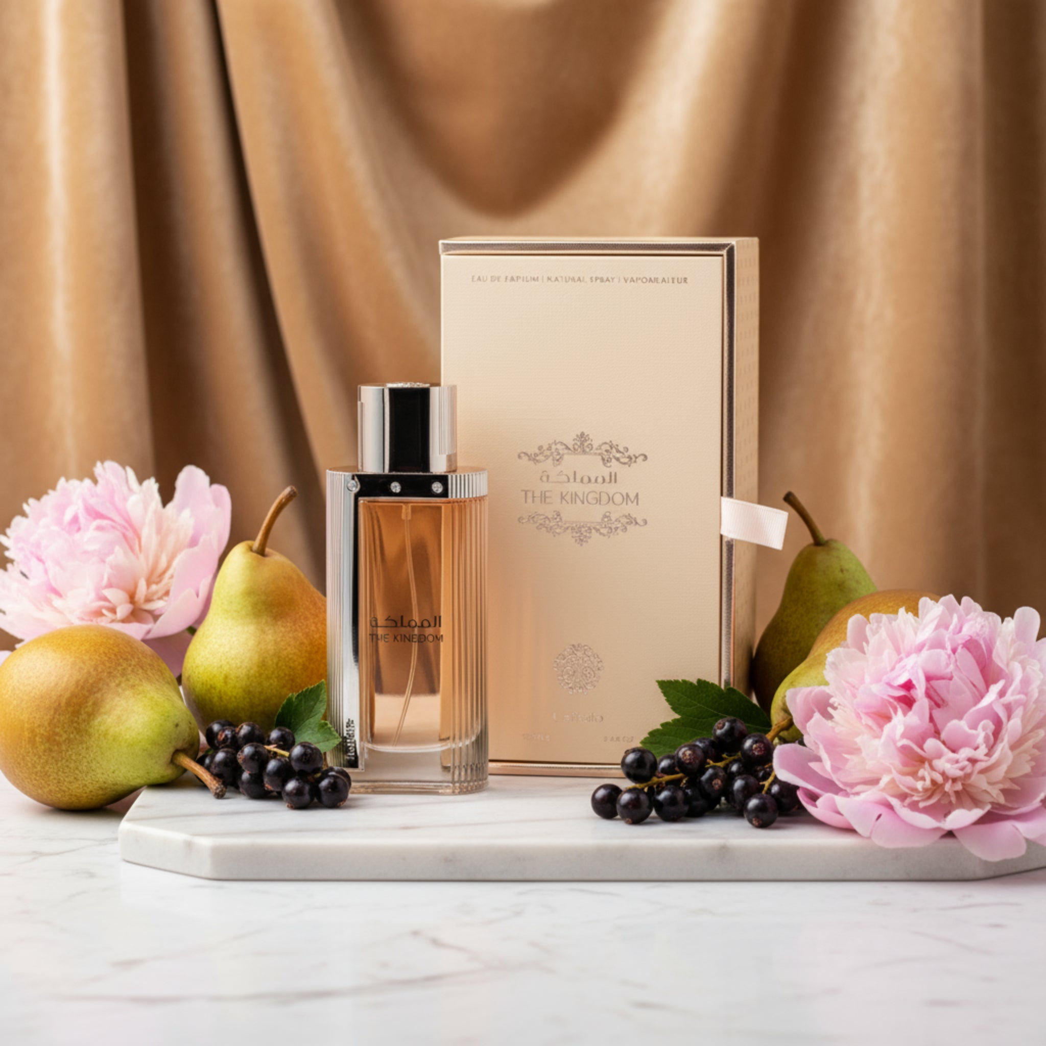 Perfume bottle and packaging of 'The Kingdom' on a white background