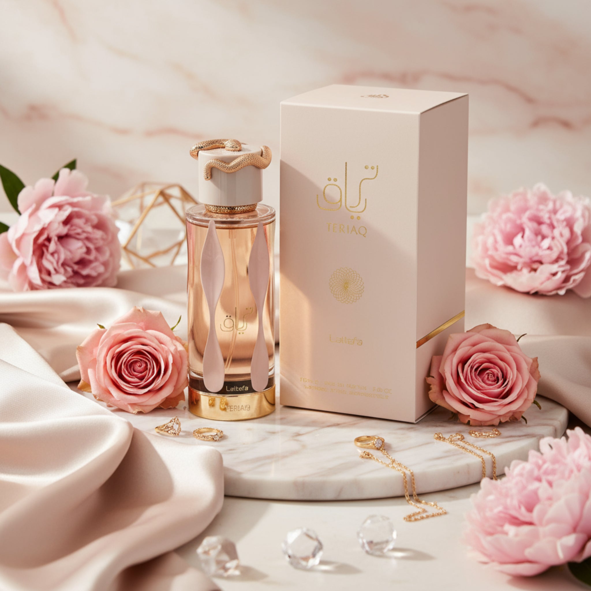 Perfume bottle and packaging with gold accents on a white background