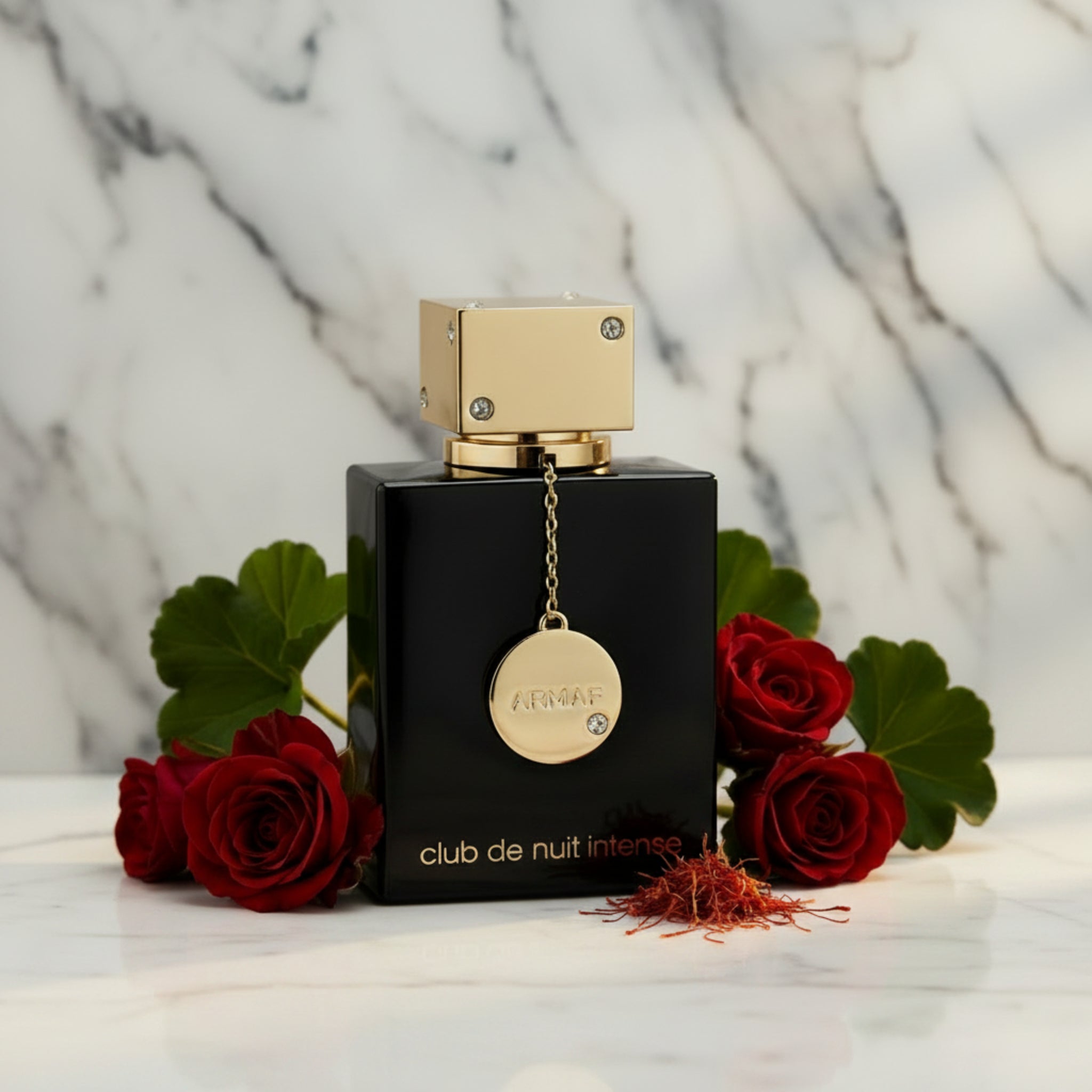 Perfume bottle with gold cap and black base on a white background