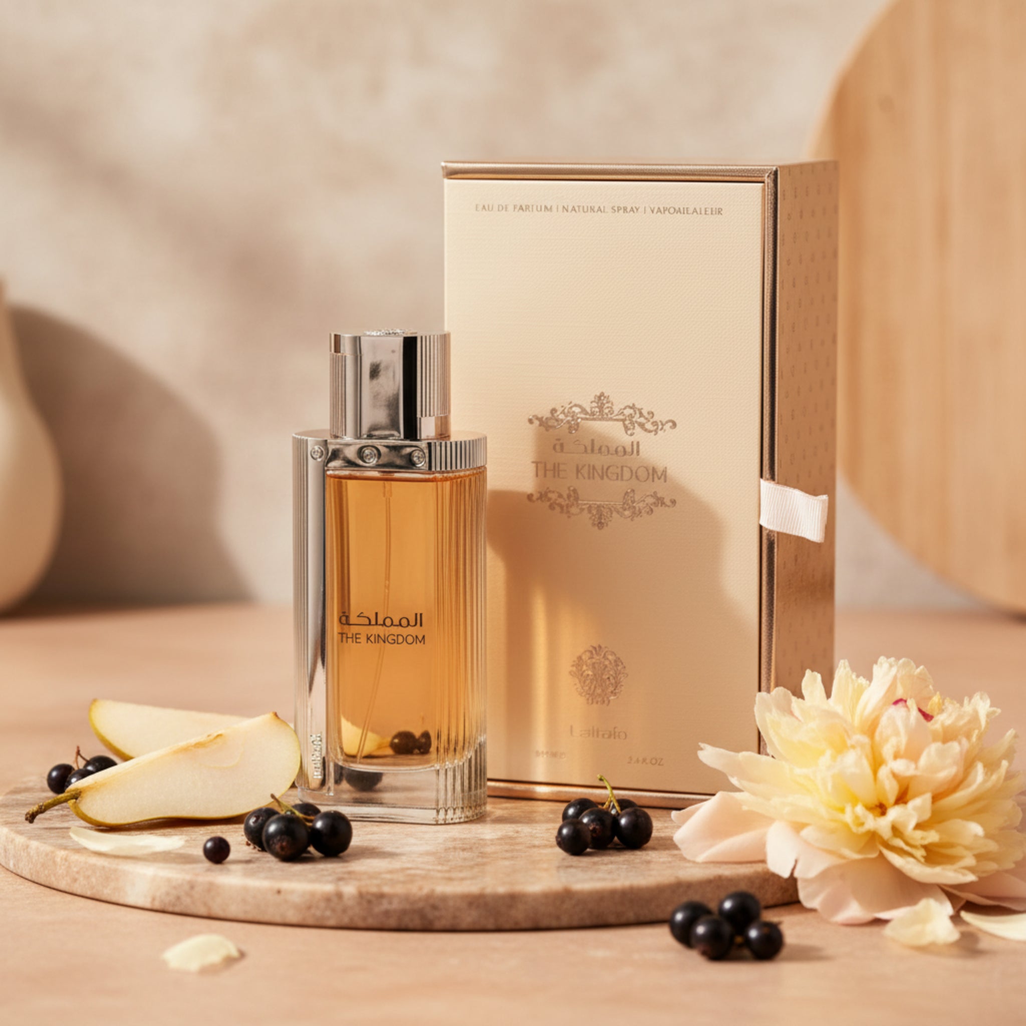 Perfume bottle and packaging of 'The Kingdom' on a white background