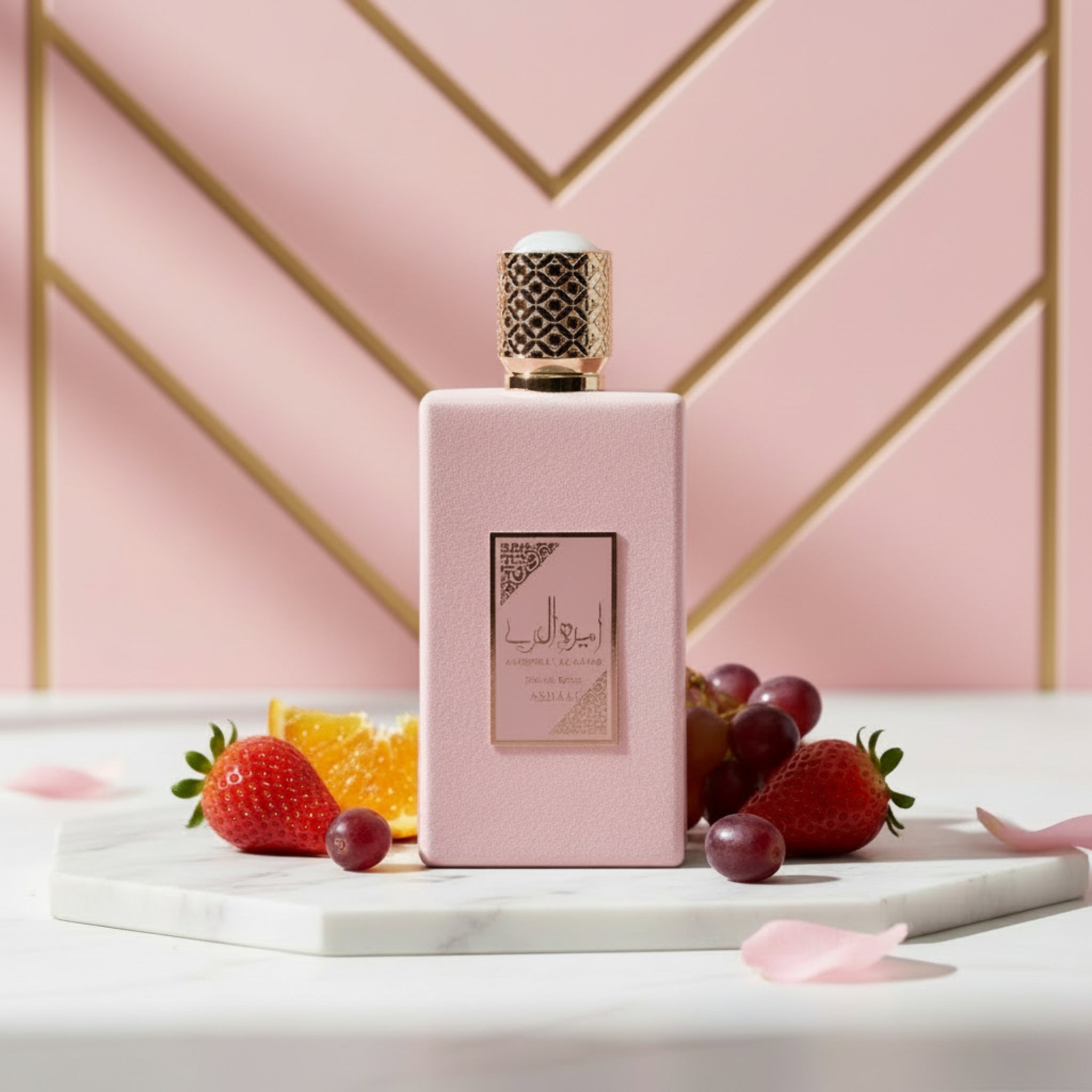 Pink perfume bottle with gold cap on a white background