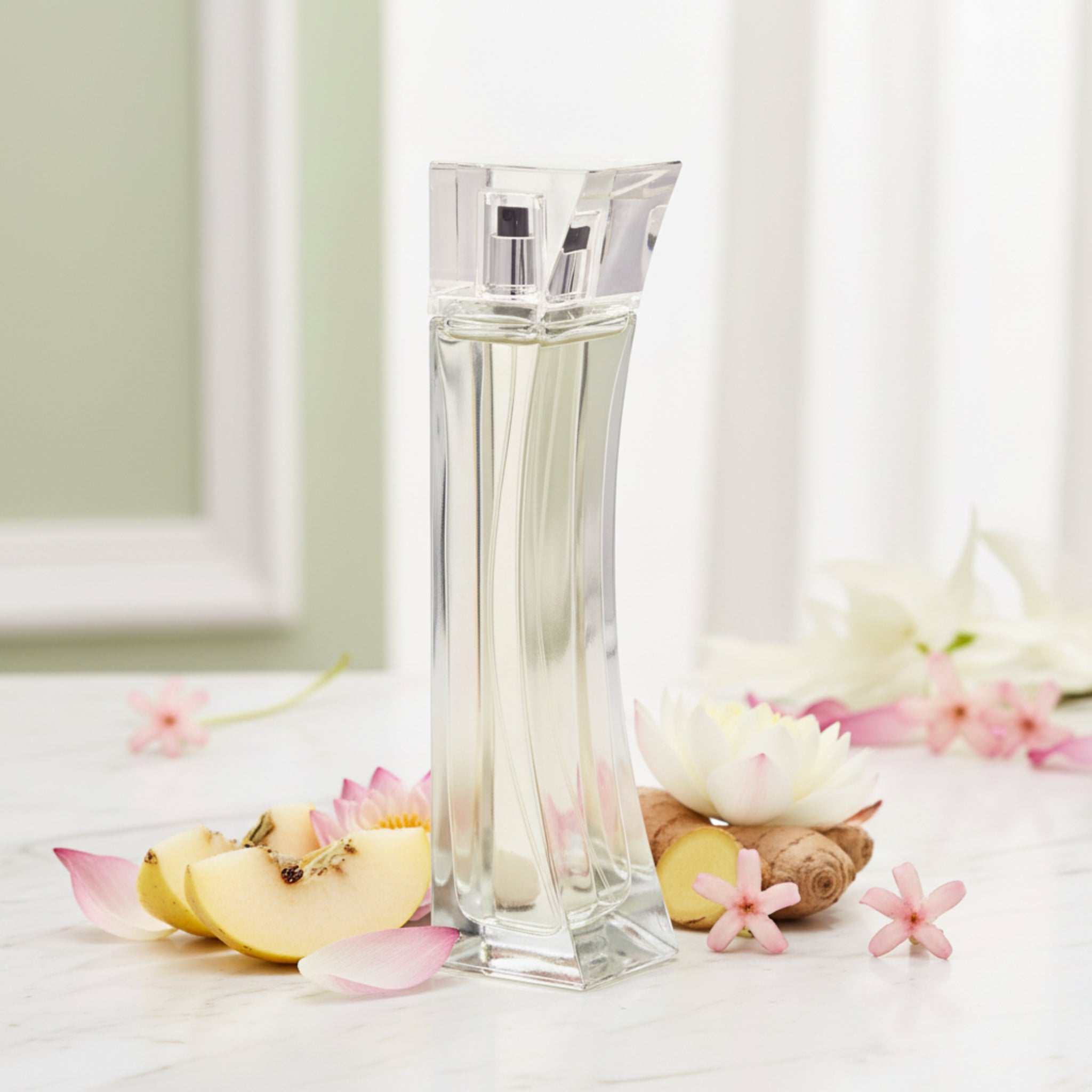 Clear glass perfume bottle on a white background