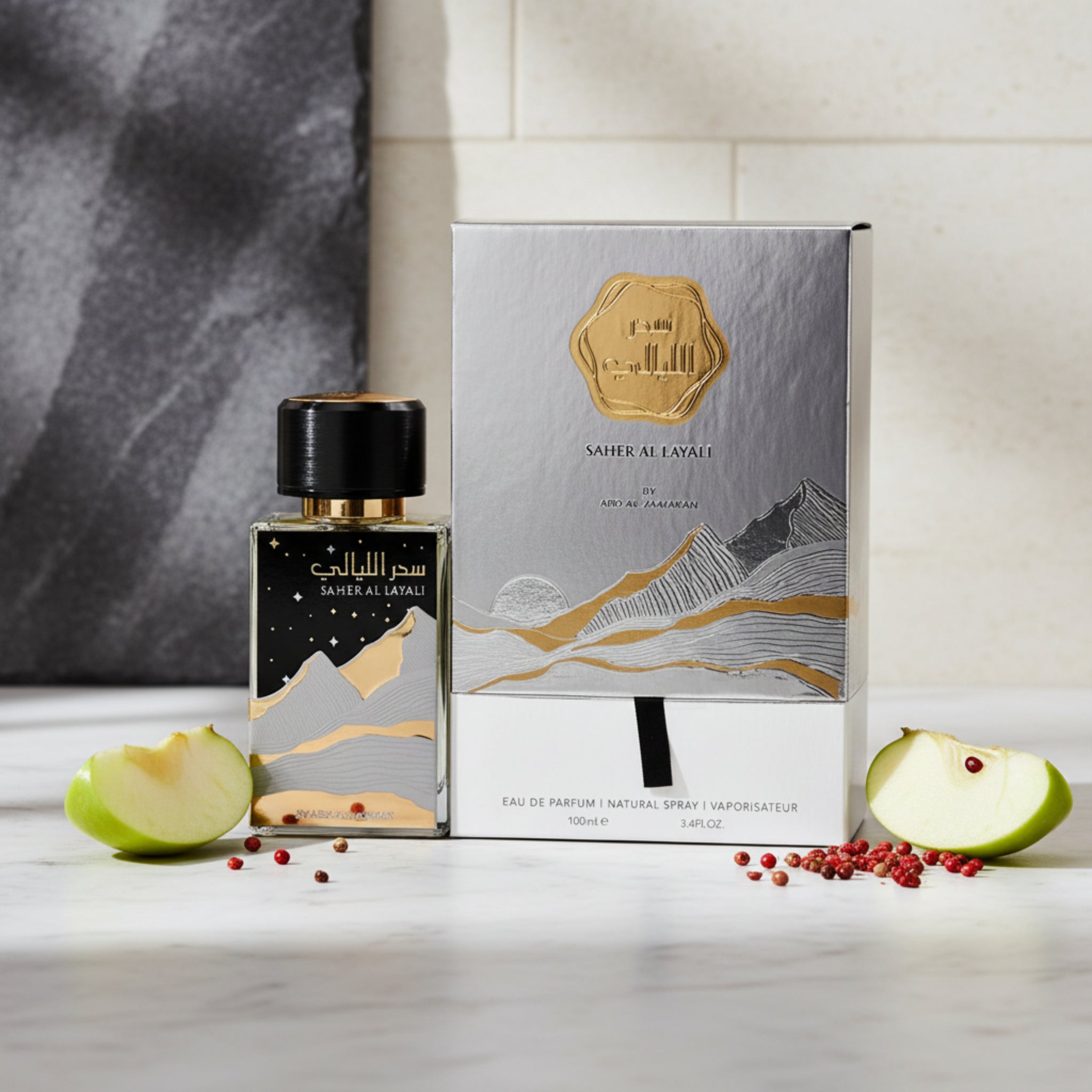 Perfume bottle and packaging with mountain design on a white background