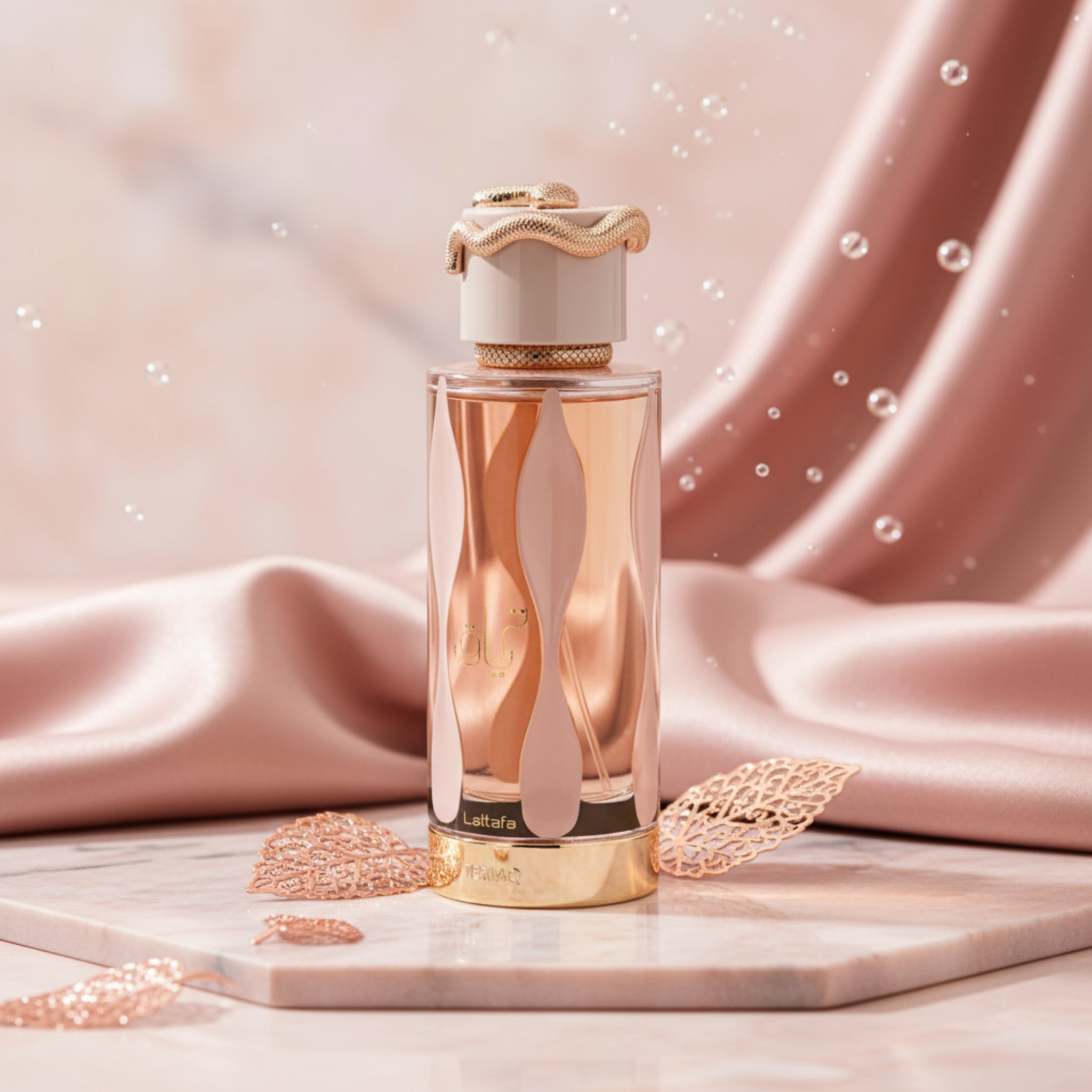 Perfume bottle with gold cap and design on a white background