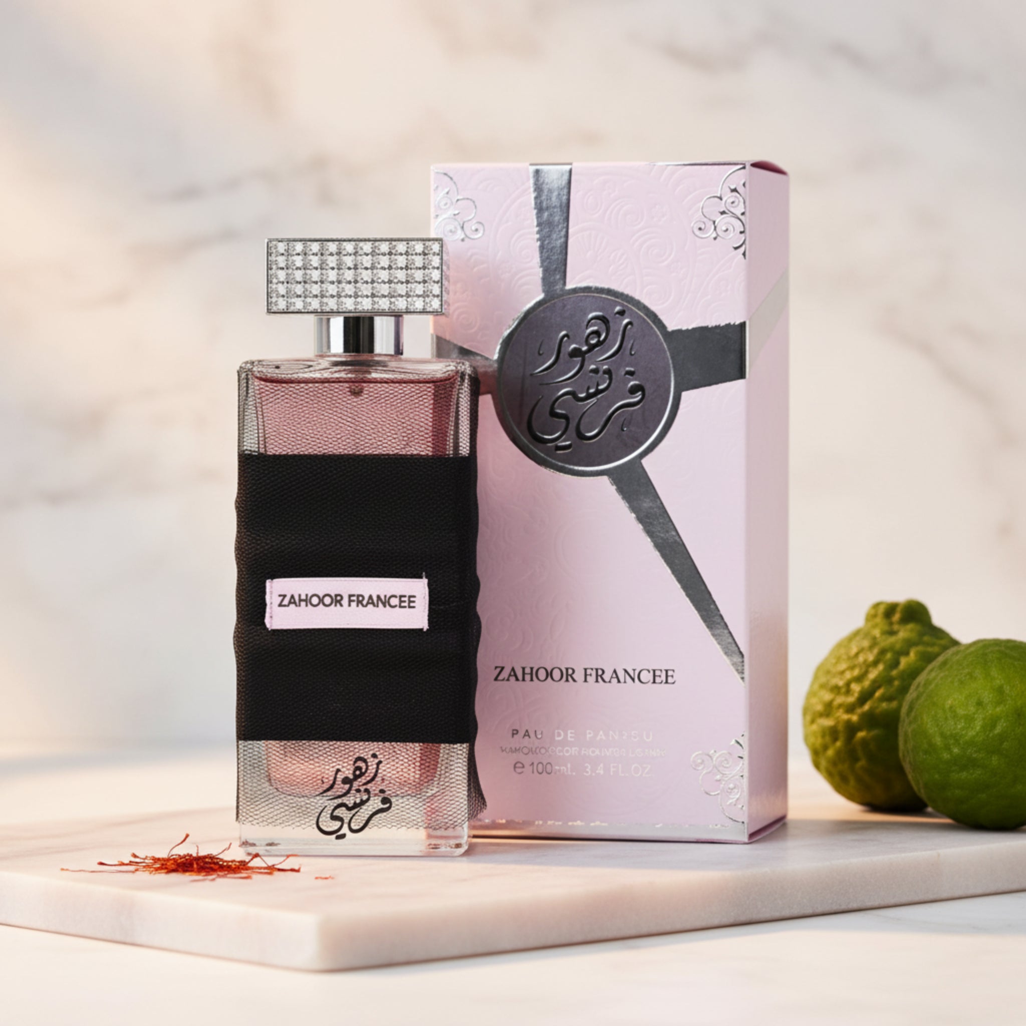Perfume bottle with black wrap and Zahoor Francee packaging on a white background