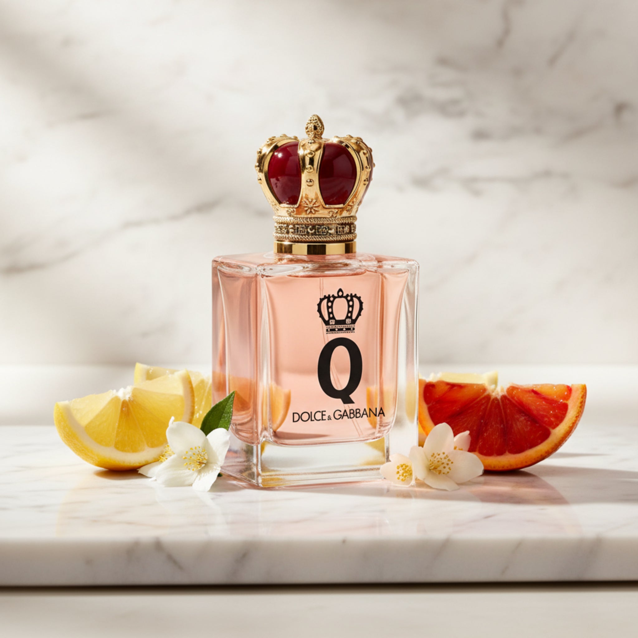 Dolce & Gabbana perfume bottle with a decorative cap on a white background
