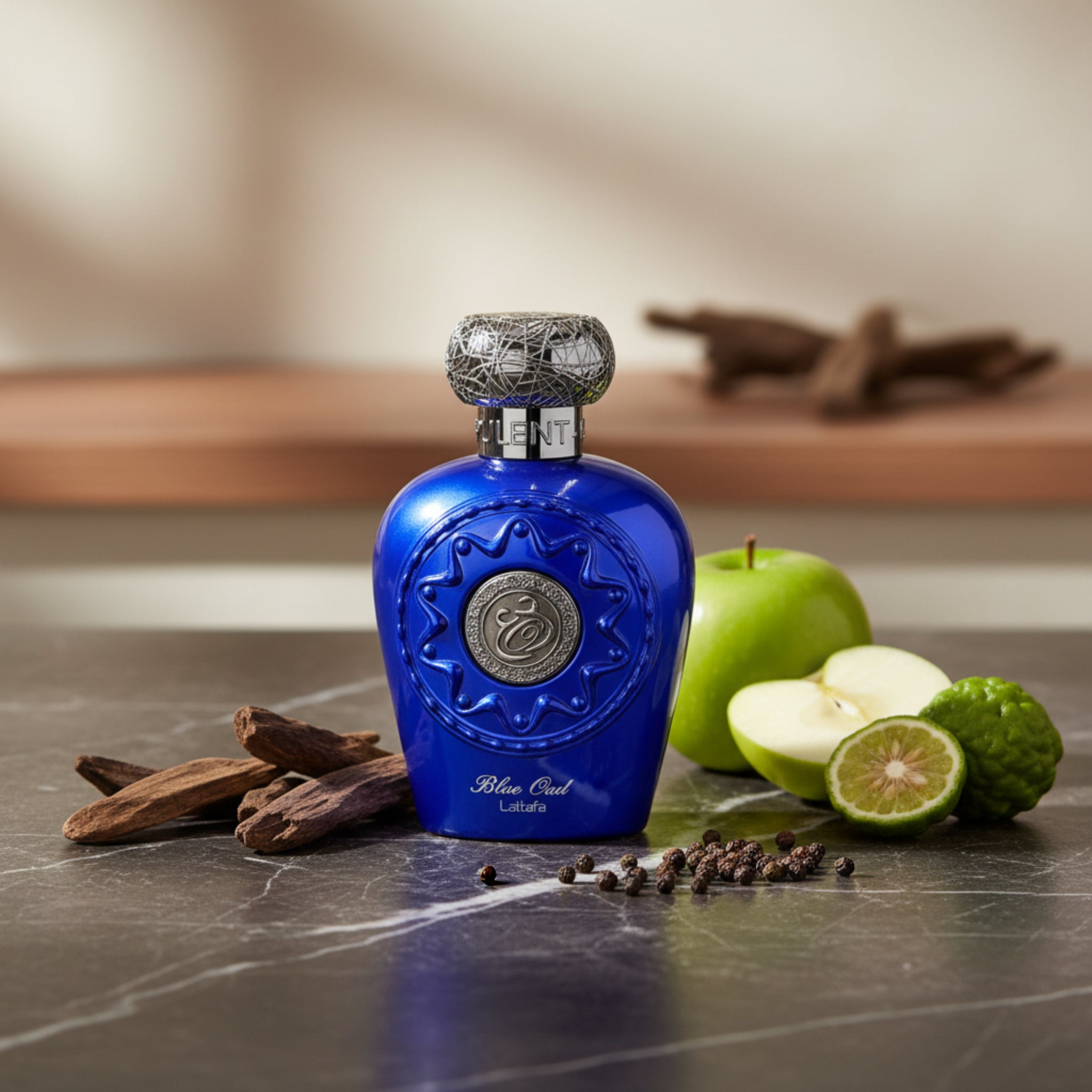 Blue perfume bottle with silver cap on a white background