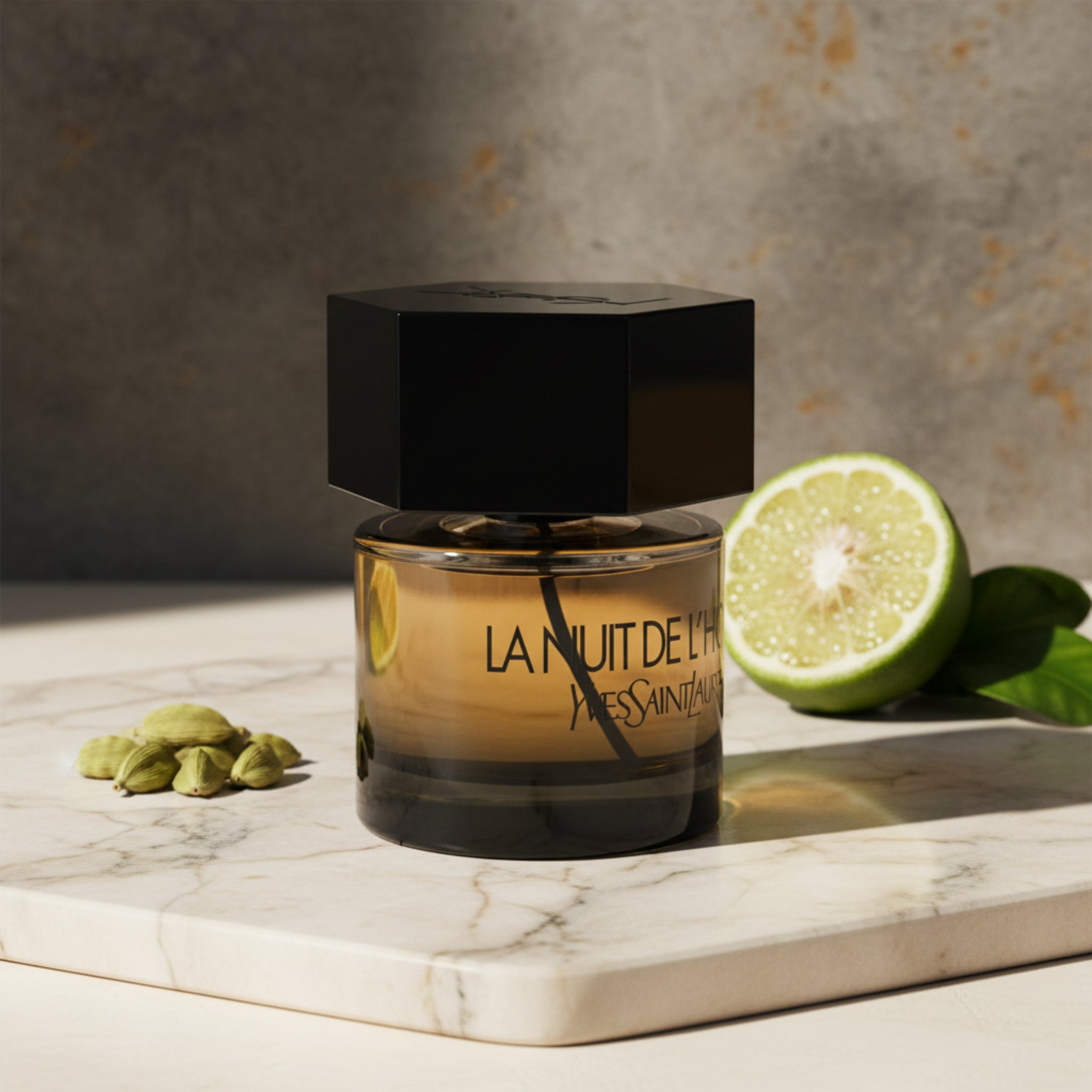 Perfume bottle labeled 'La Nuit de L'Homme' by Yves Saint Laurent on a white background